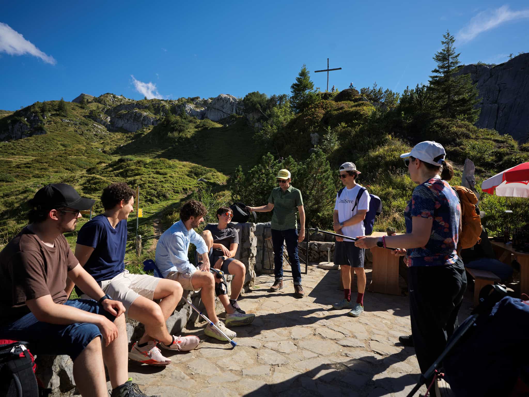 UniSieve team gathered at an alpine rest stop during a company hike