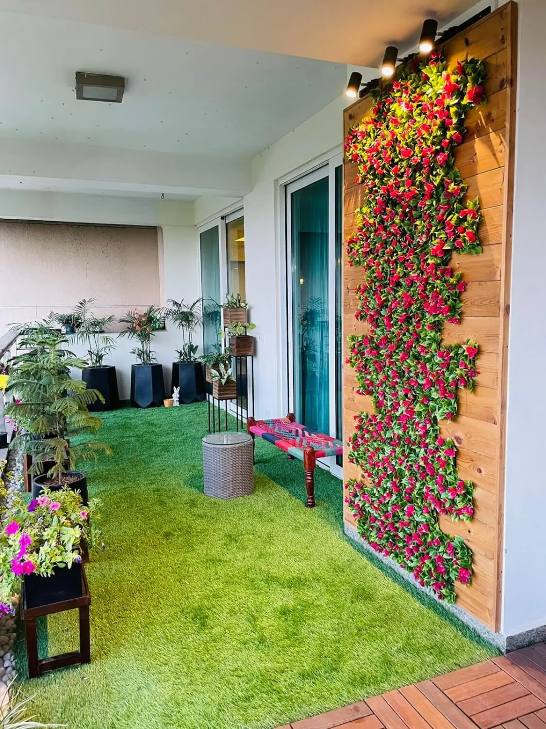 Balcony makeover with green wall and seating in Gurugram