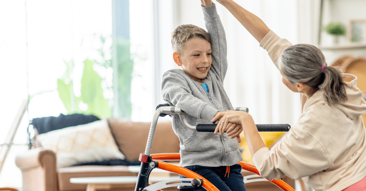A PT provides concierge physical therapy to a young patient in their home.