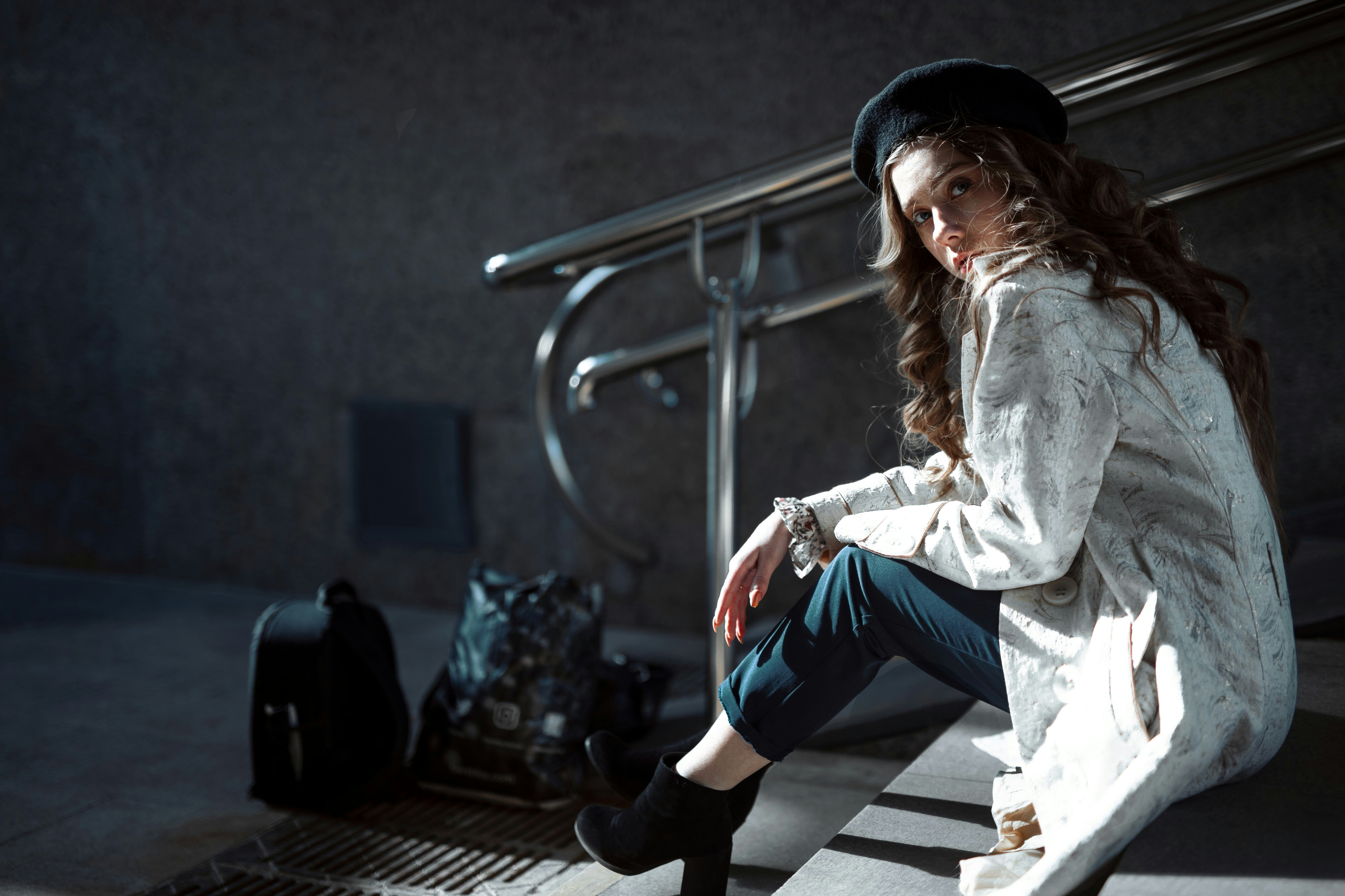 woman in white sitting on stairs - What Color Season Am I? 