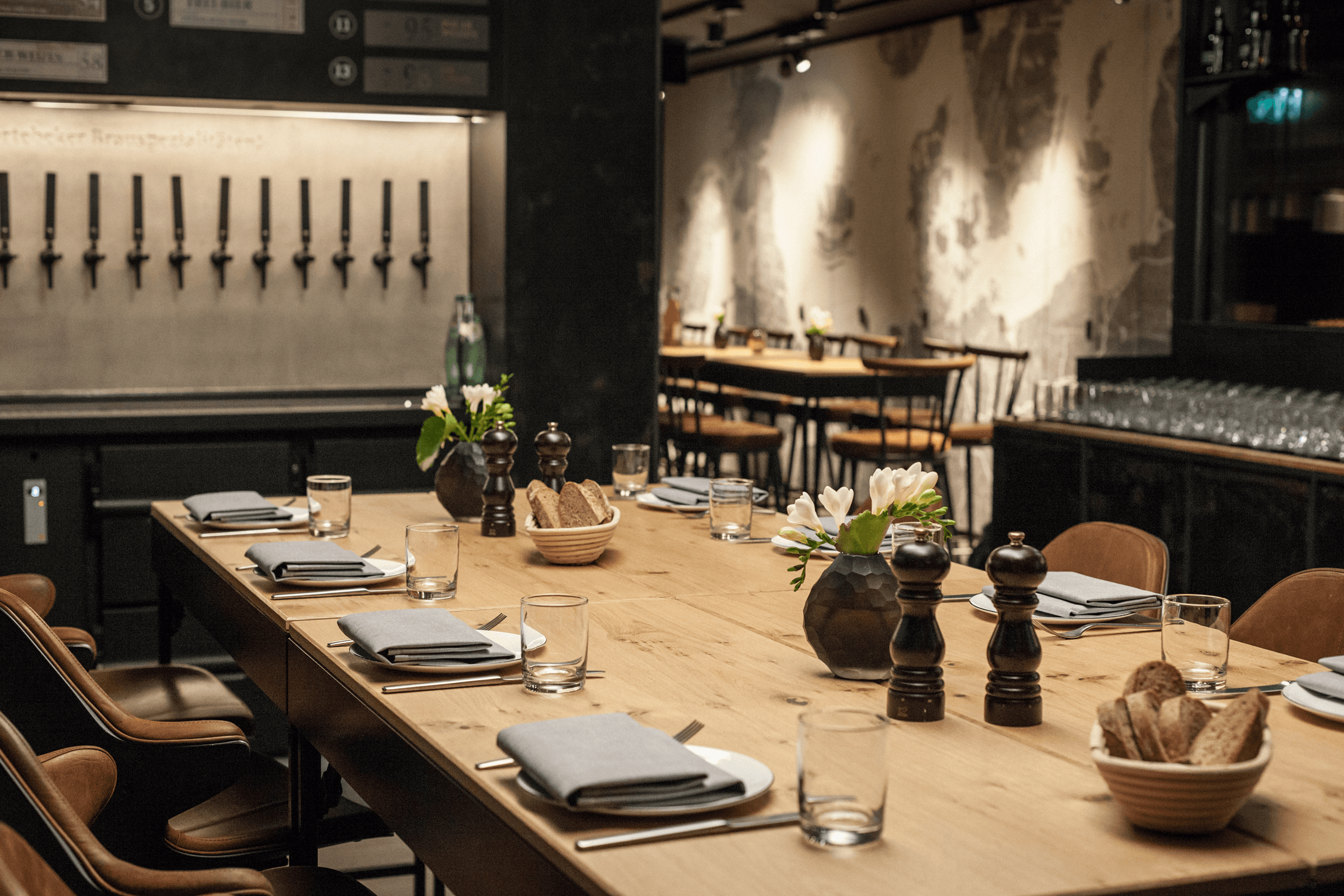 Restaurant setting with place settings and beer taps