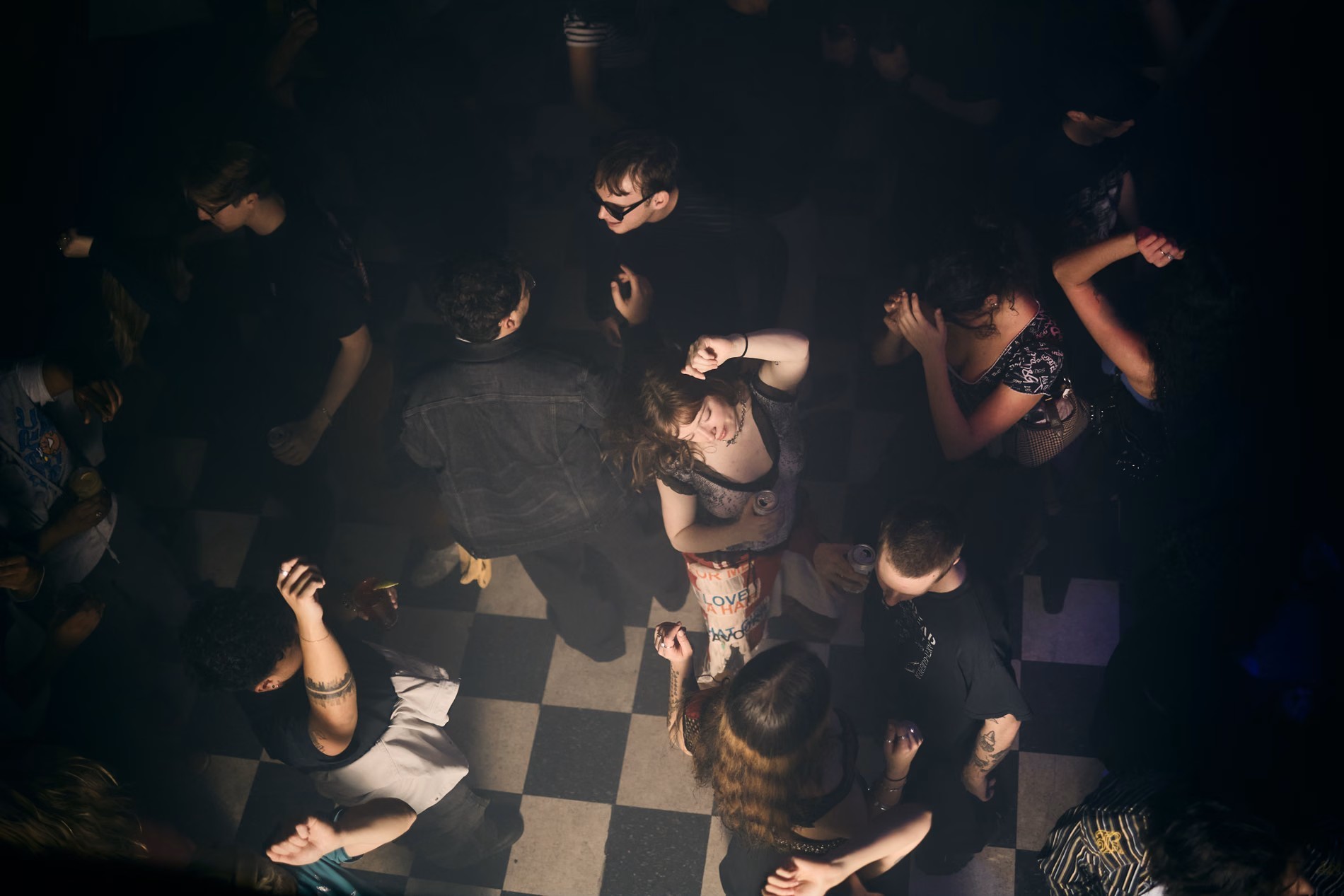 Stock photo of partygoers dancing shot from above