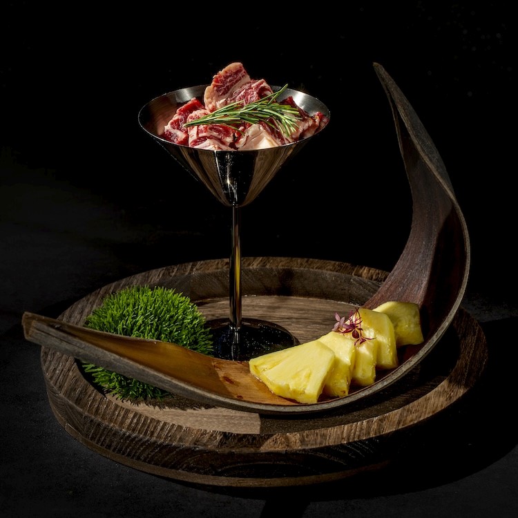 a table topped with bowls and bowls filled with food