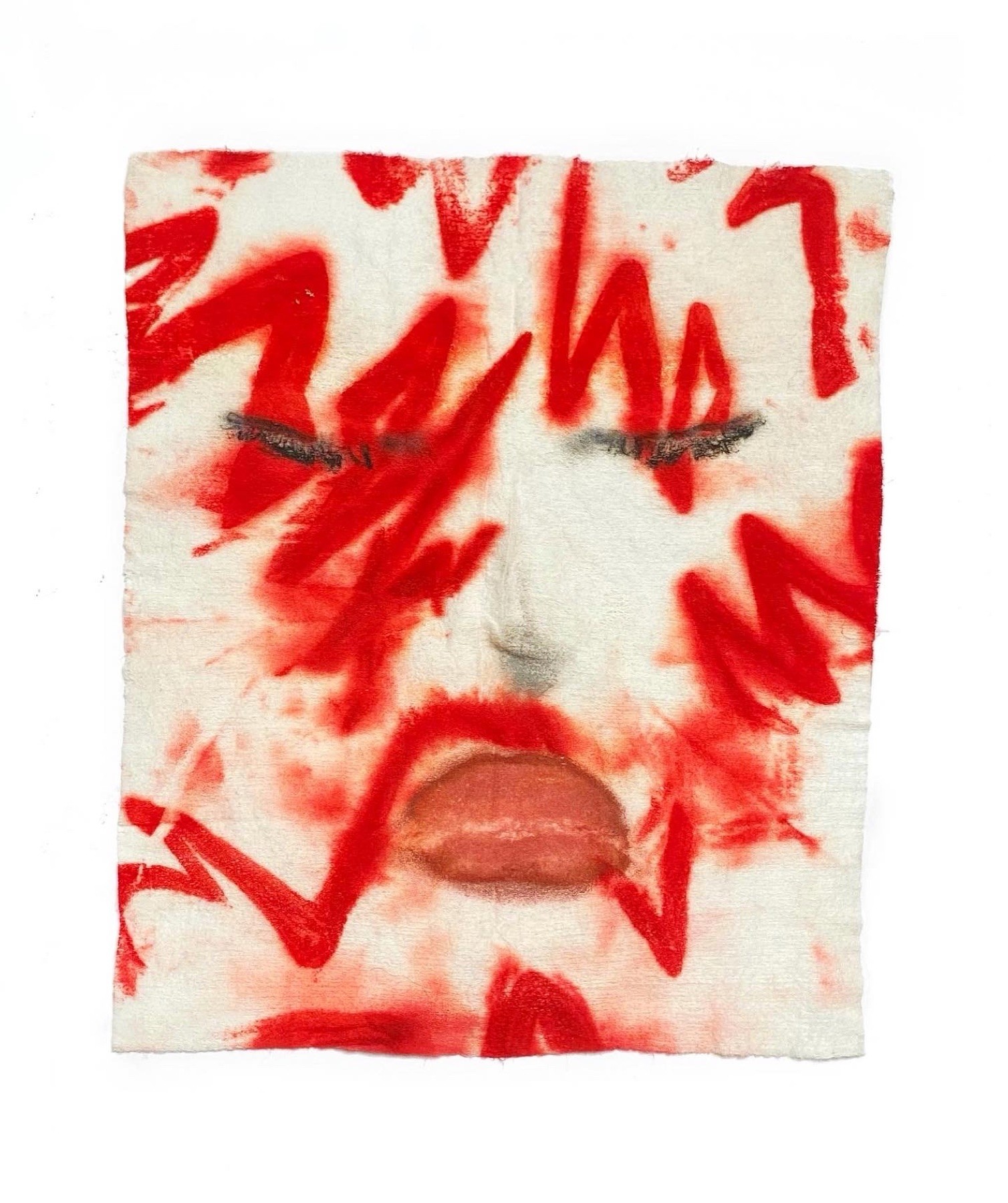 White face wipe carrying an abstract red face print and closed lashes