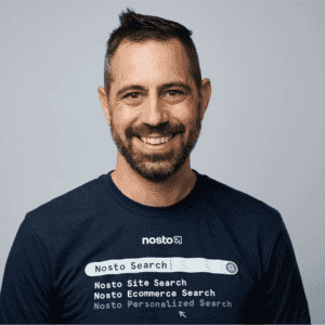 Black and white portrait of a smiling person with curly hair