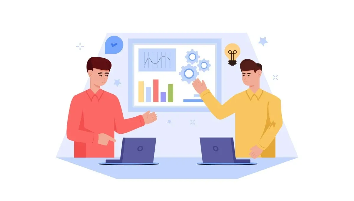 Illustration of two people seated at desks with laptops, discussing charts and graphs displayed on a large board behind them—symbolizing how thorough documentation, analysis, and clear communication distinguish senior engineers from others in the profession.