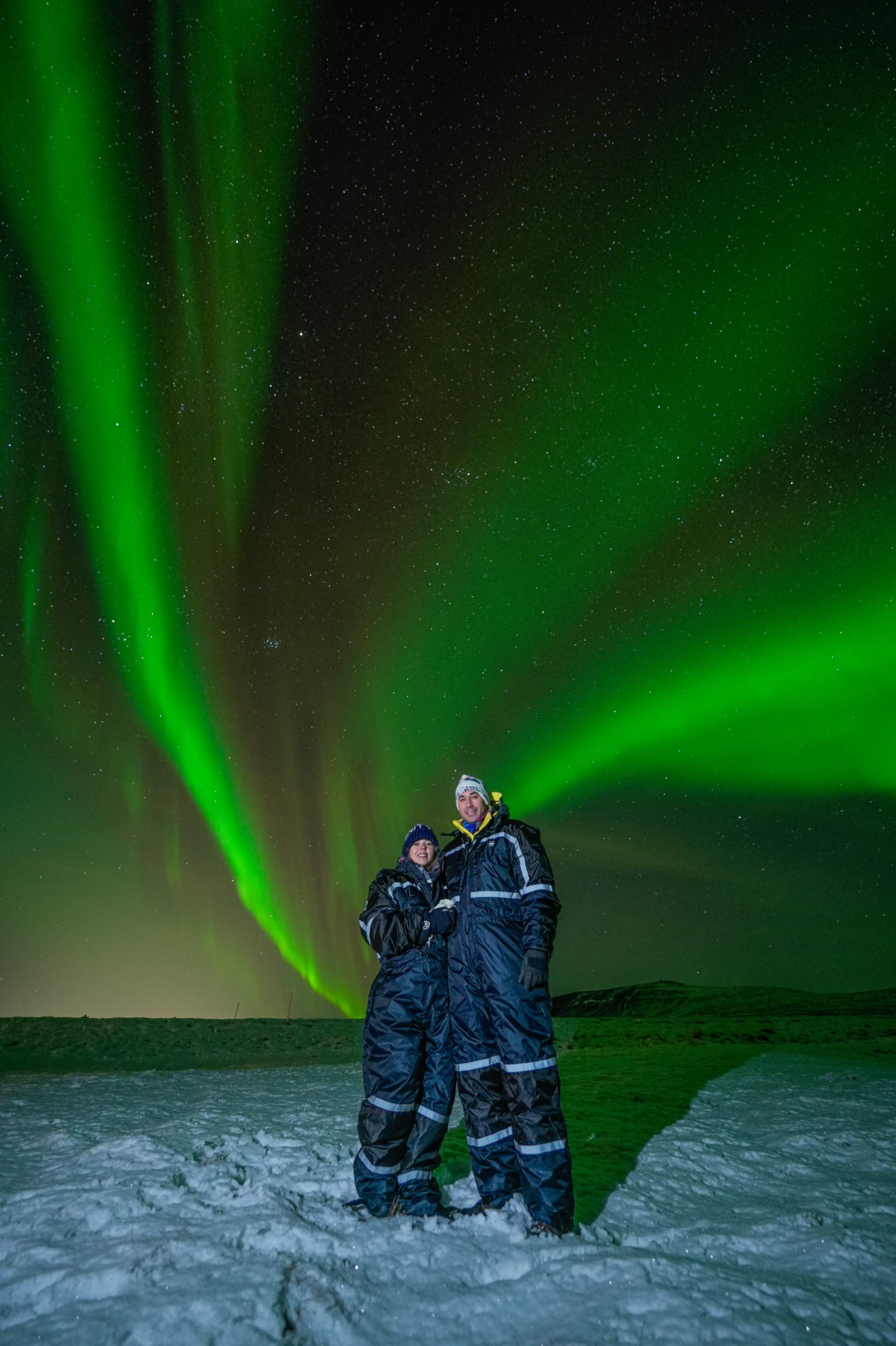 Northern Lights tour photography from Aurora Experts in Iceland, featuring guests beneath the aurora, winter landscapes, and vivid skies over remote Icelandic locations.