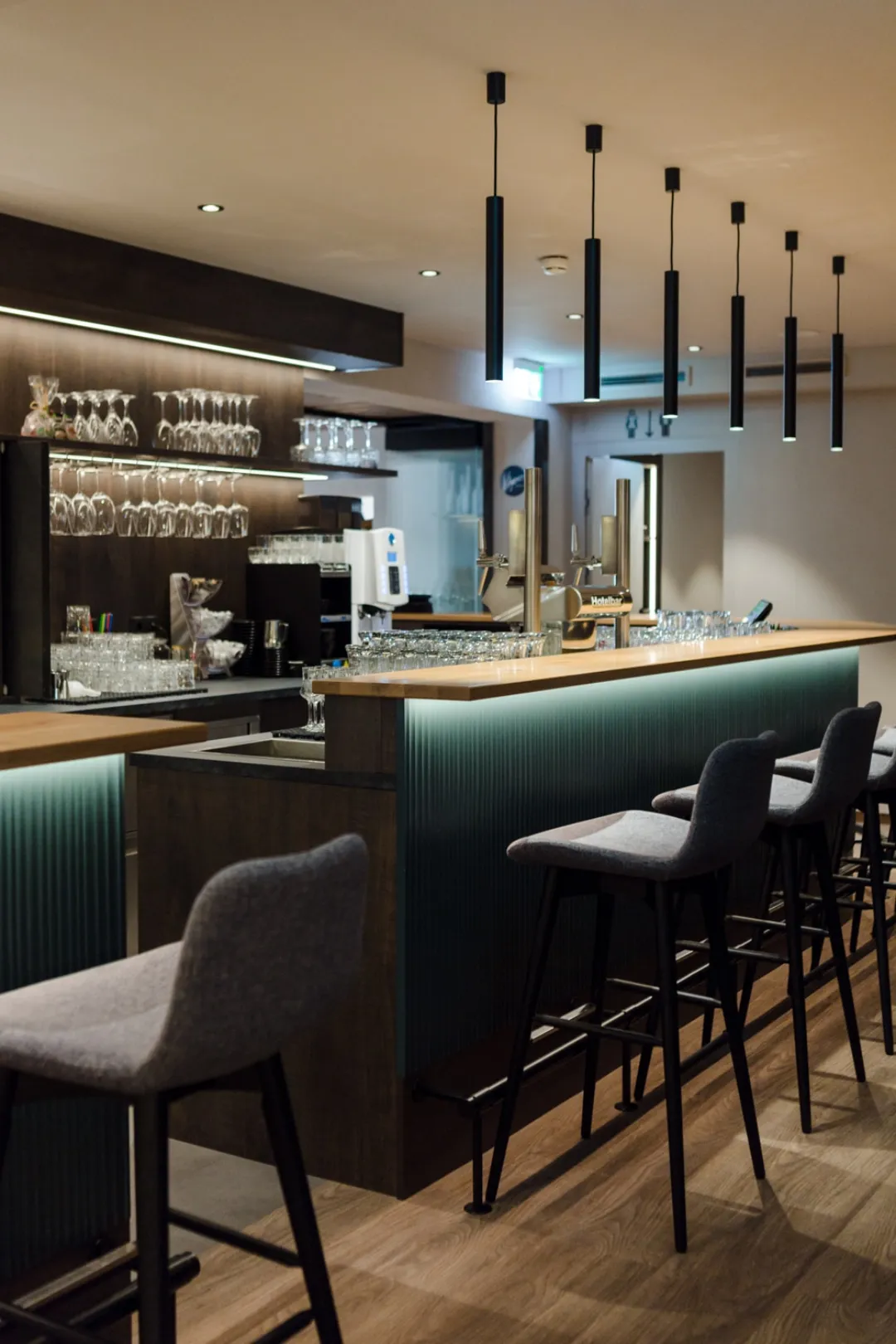 Restaurant bar with glasses and stools
