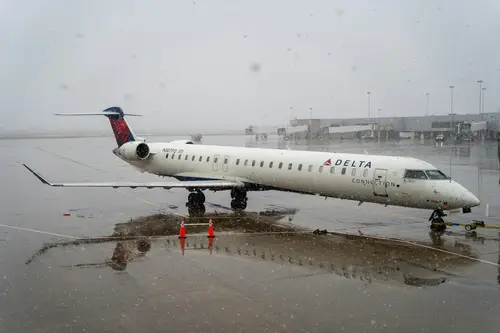 a plane on runway and snowy weather