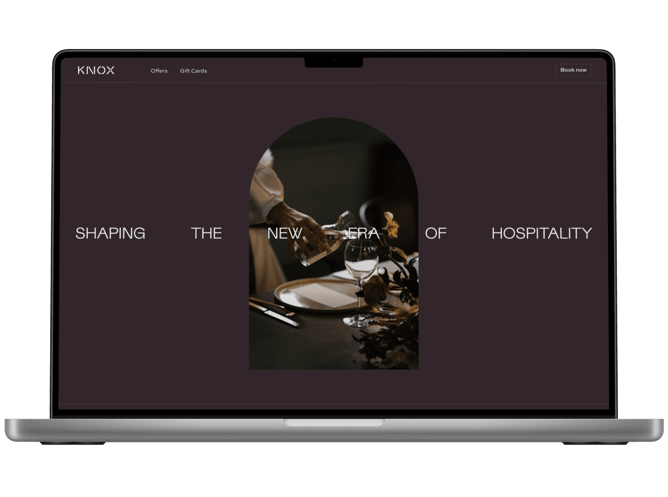 A website design showcase in a Macbook Pro mockup