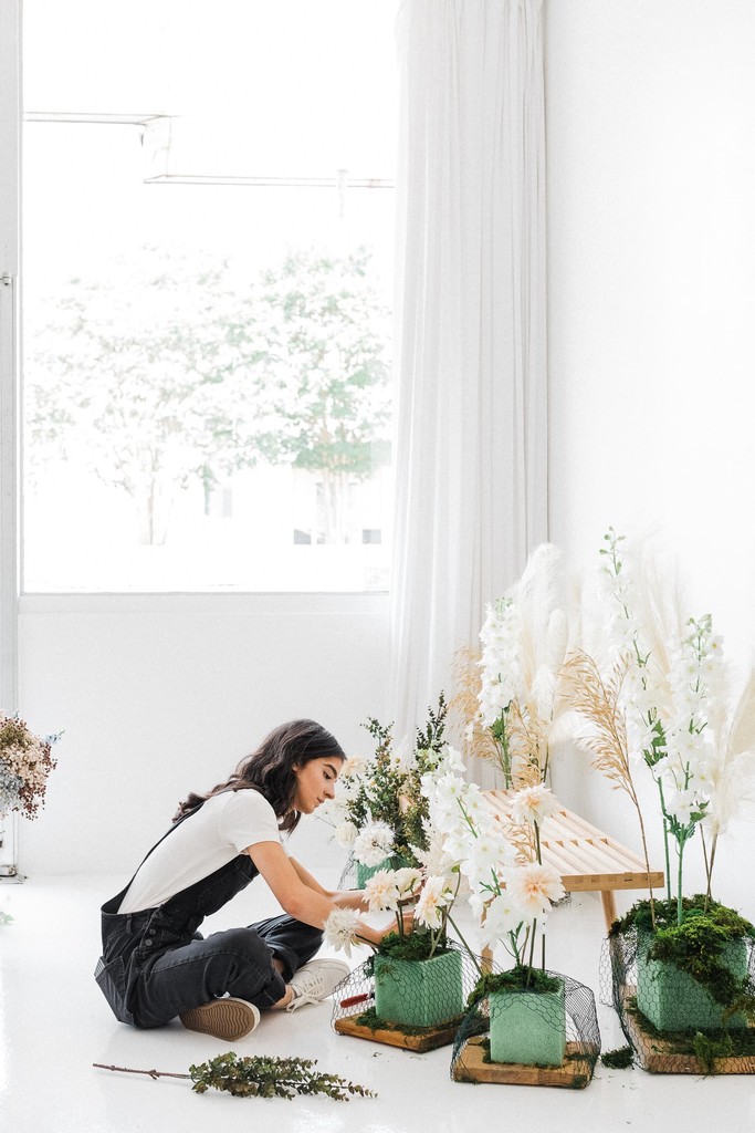 Woman decorating with flowers