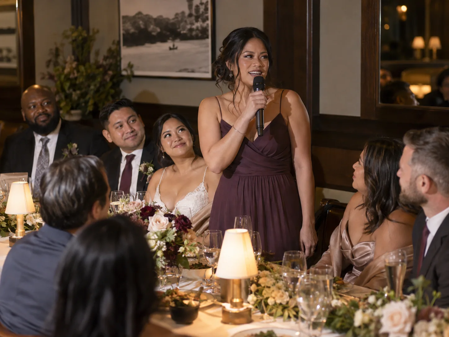 Wedding MC guide illustration of a guest giving a toast while other guests listen.