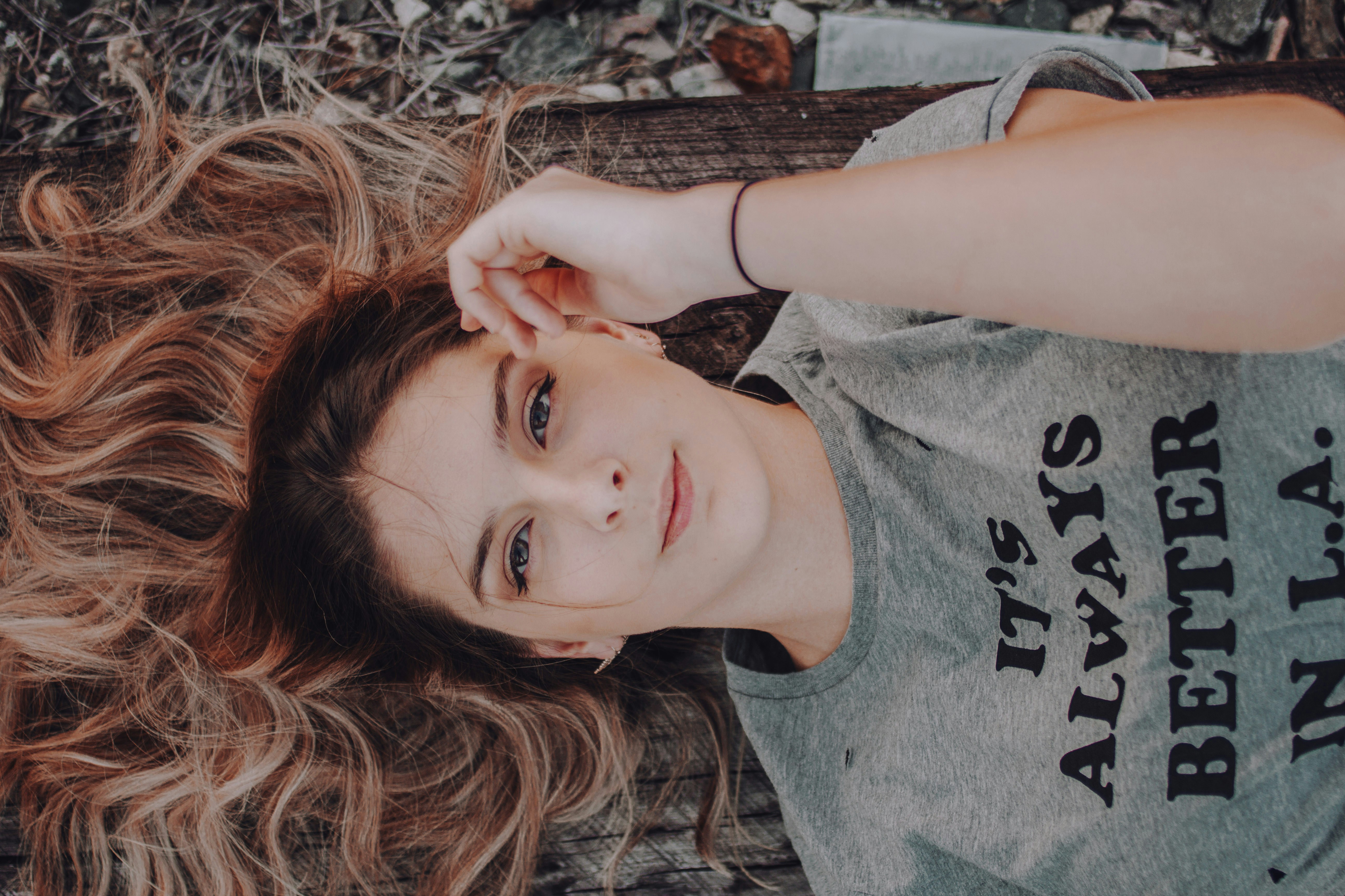 woman laying down on ground - Best Colors For Neutral Skin Tone