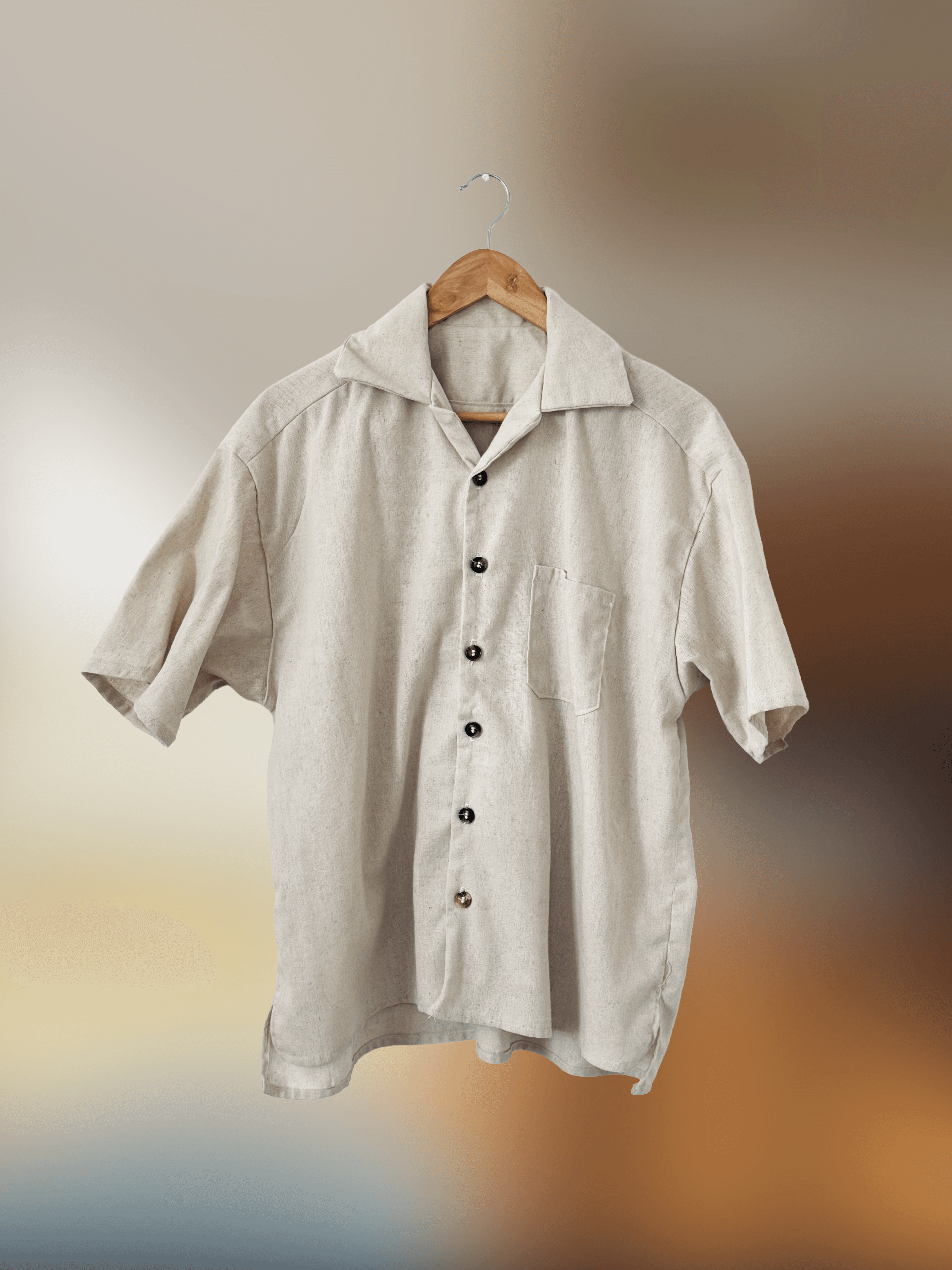 Front of off-white button down t-shirt with chest pocket