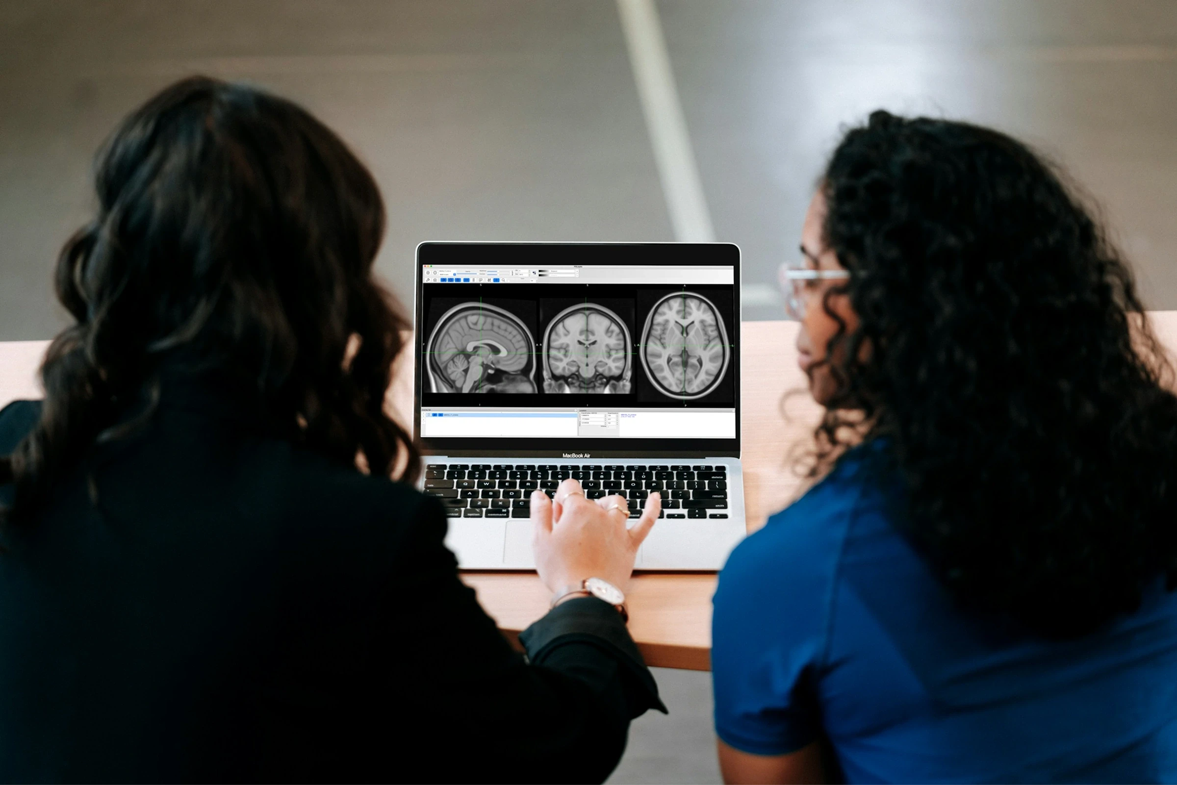 Psychiatrist and patient reviewing treatment information together during a medication follow-up.