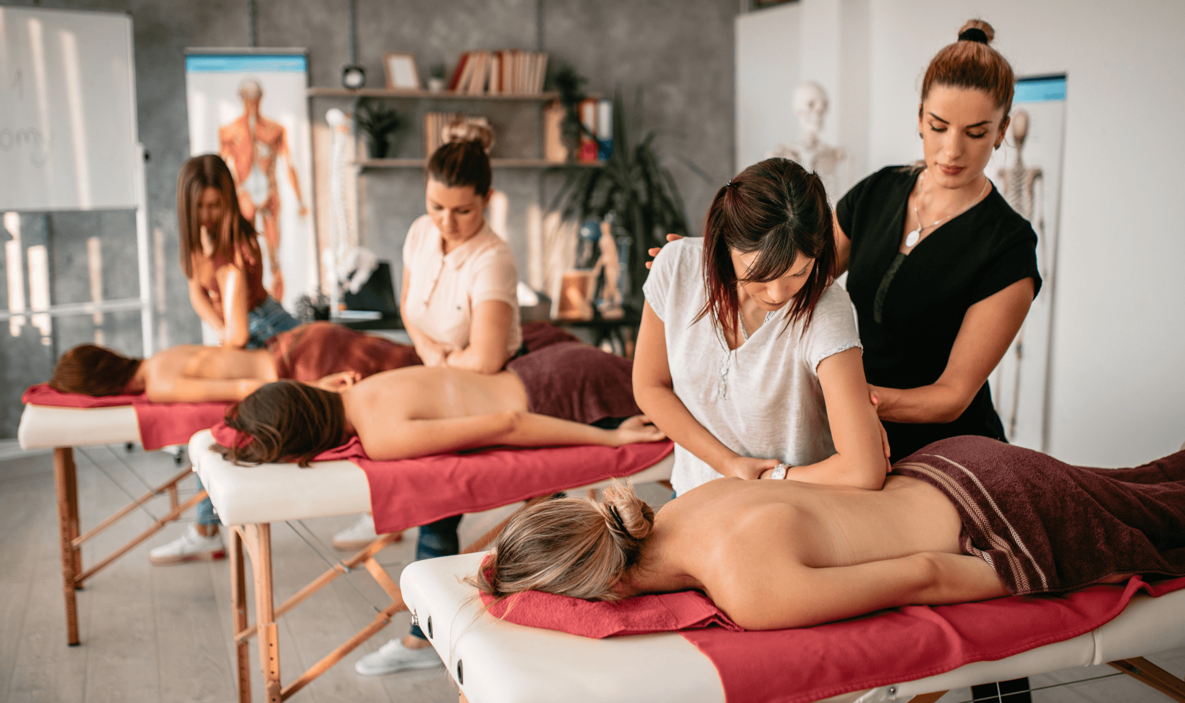 massage tutor providing hands-on guidance