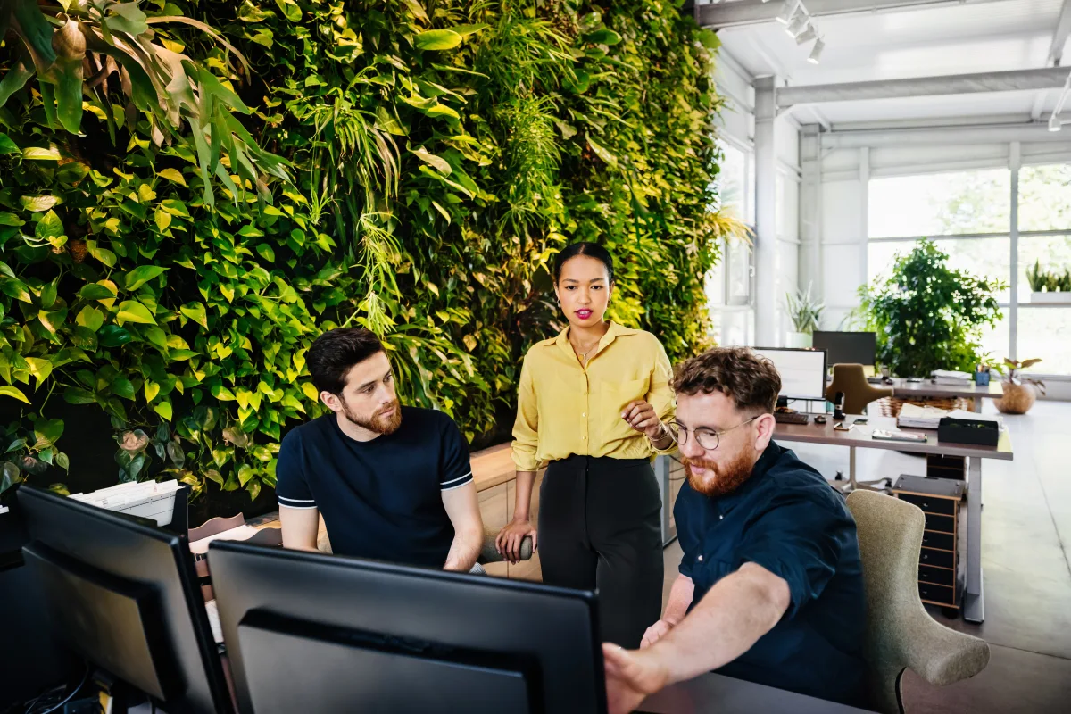 Asian female wearing a yellow shirt in a corporate workplace