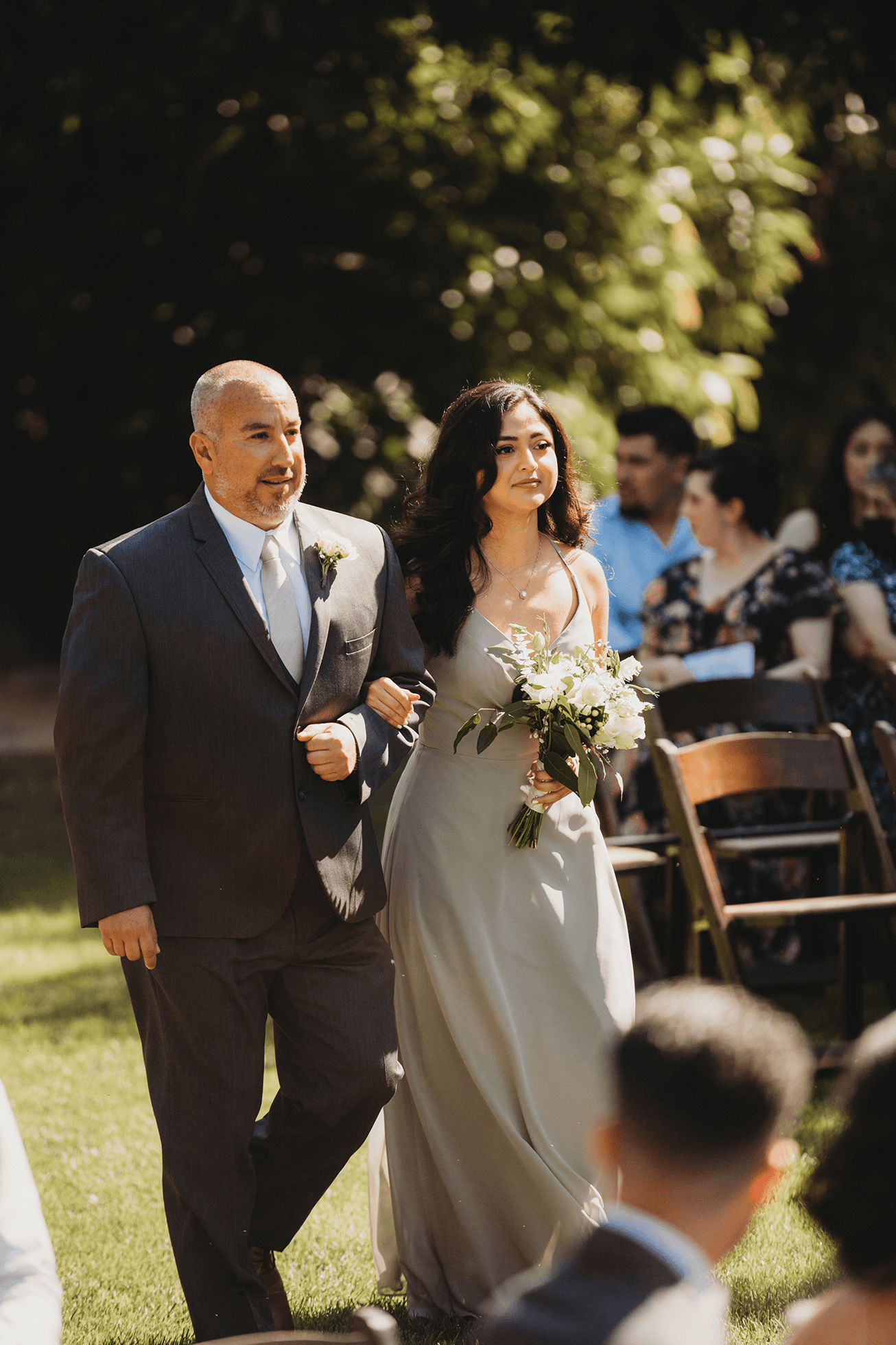 Flat lay wedding details with bouquet, rings, and sparkling bridal heels