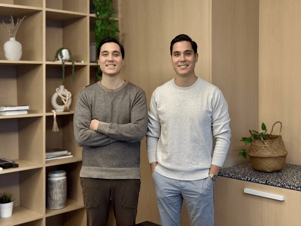 Two Alpharun founders standing together in their office