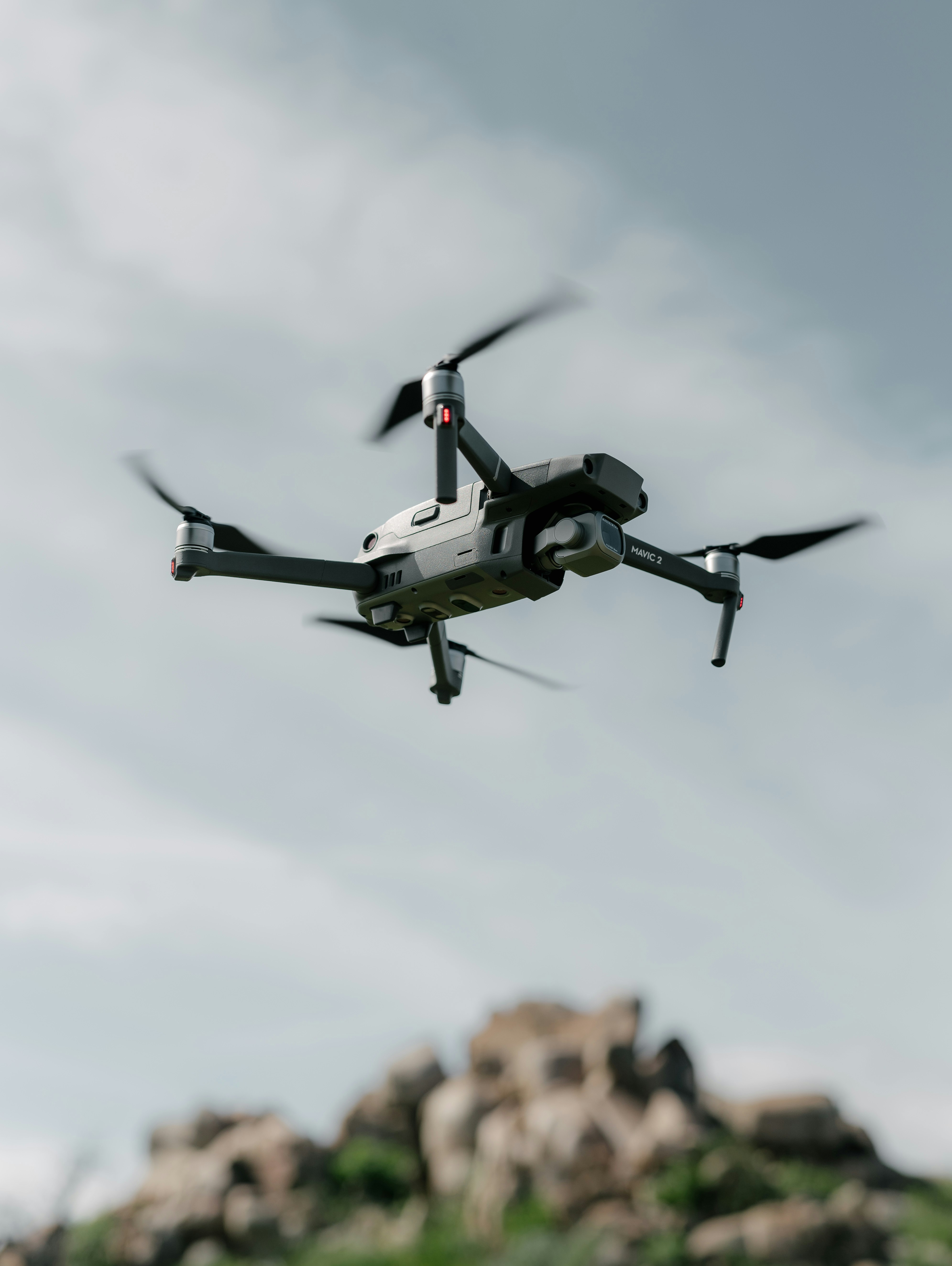 gray quadcopter flying