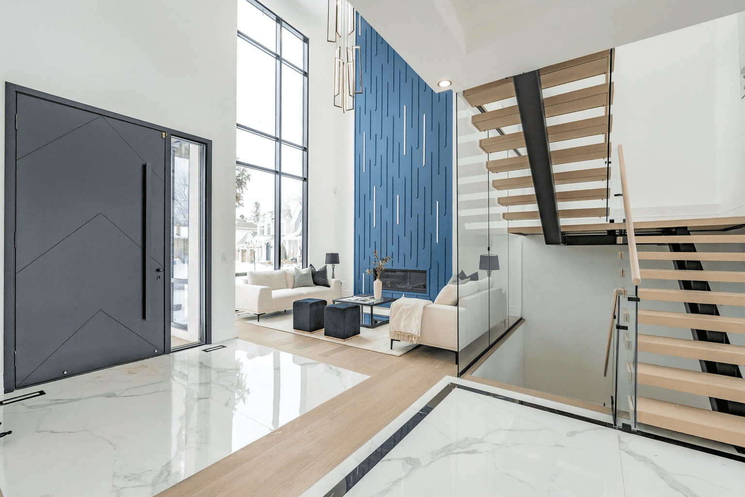 Modern living room with vertical garden, yellow sofas, and stylish coffee tables.