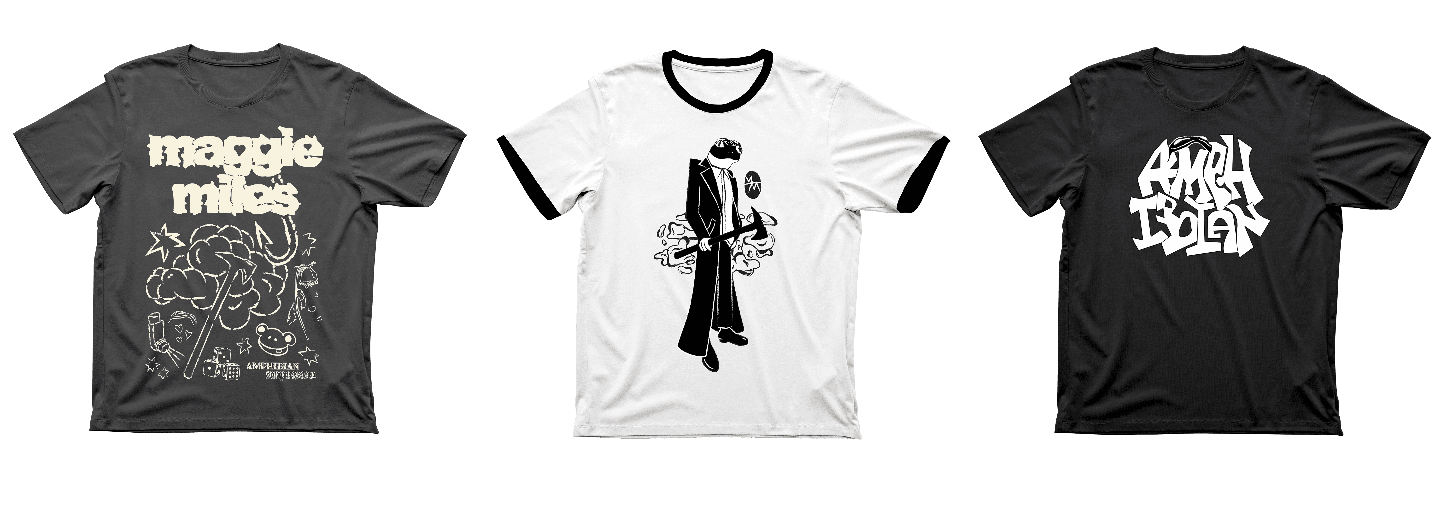 Flat lay out of three t-shirts for Maggie Miles. 1 with doodle outlines of maggie miles symbols, 1 with an illustrated frog in a trenchcoat with an axe, one with graffitti type saying "amphibian" and black goggles on top