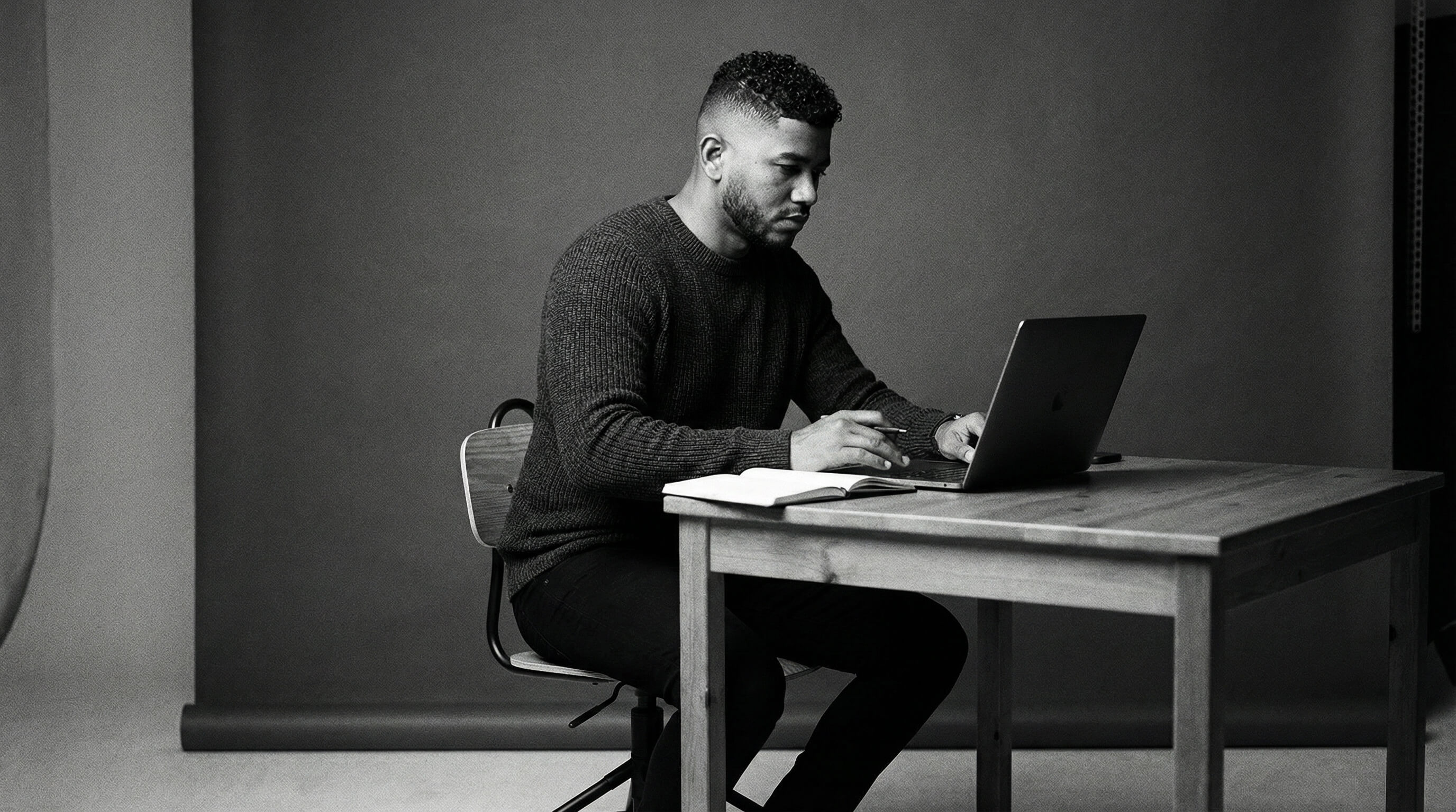 Ruben Cespedes Working on a Laptop