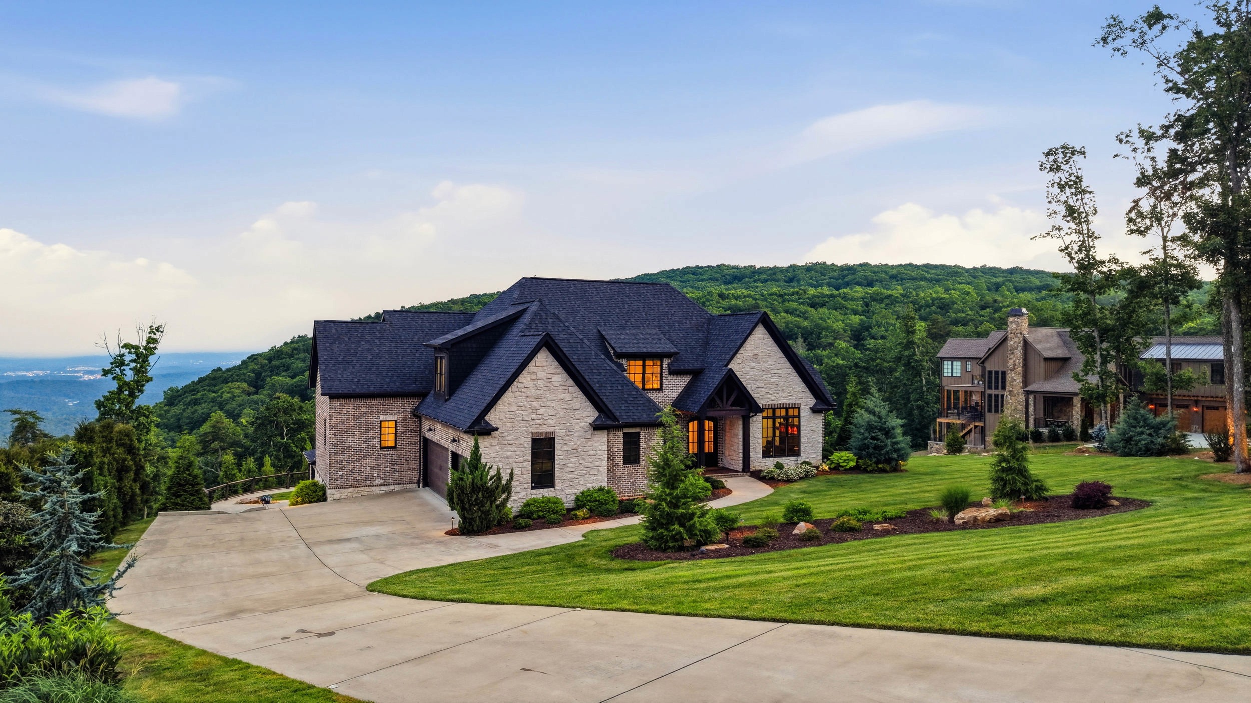 The home and the valley beyond it from the drive