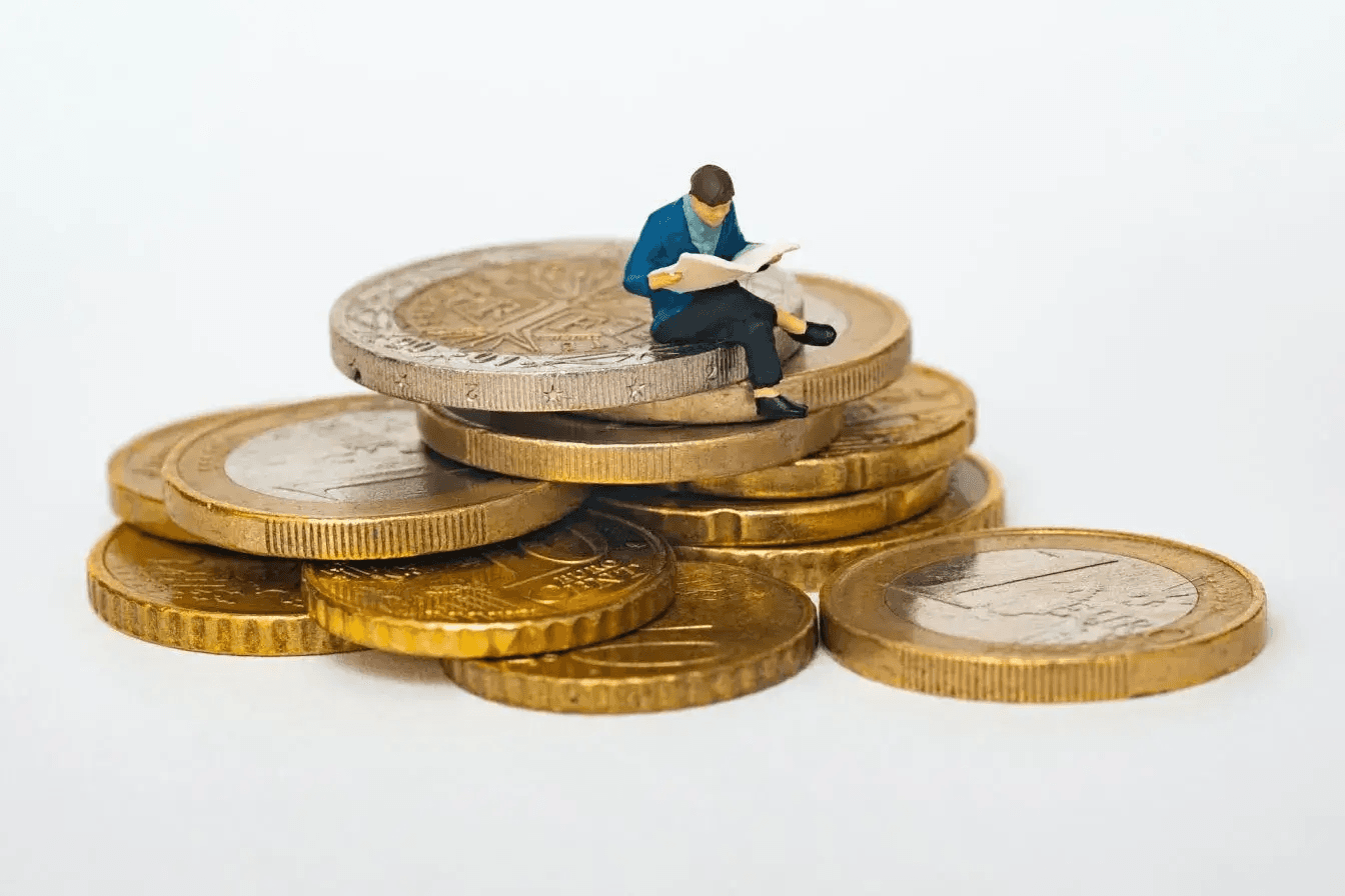 man sitting on coins - Use ChatGPT to Categorize Data