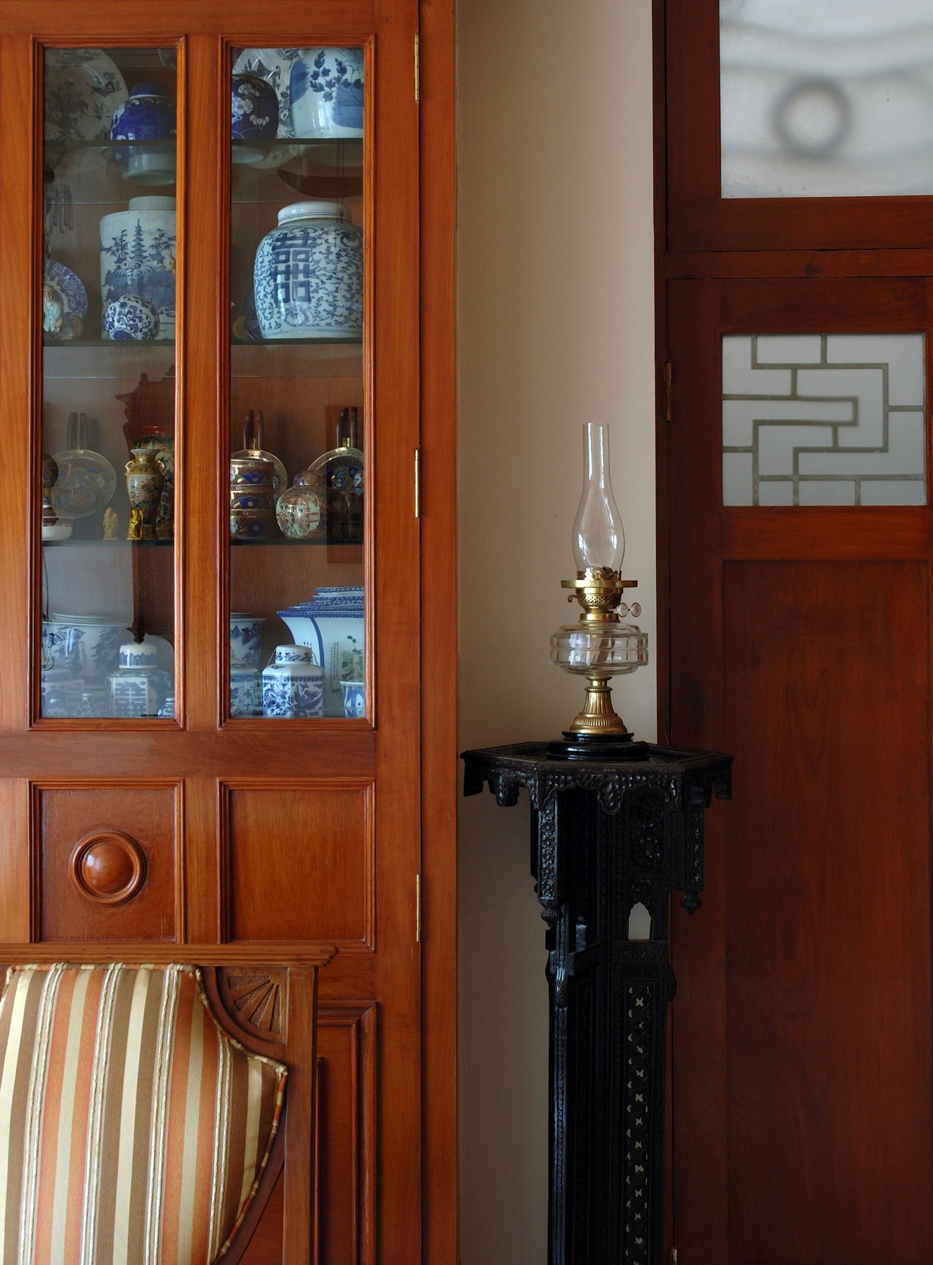 Nature-inspired preschool entrance with sculptural tree partitions and suspended green leaf ceiling panels.