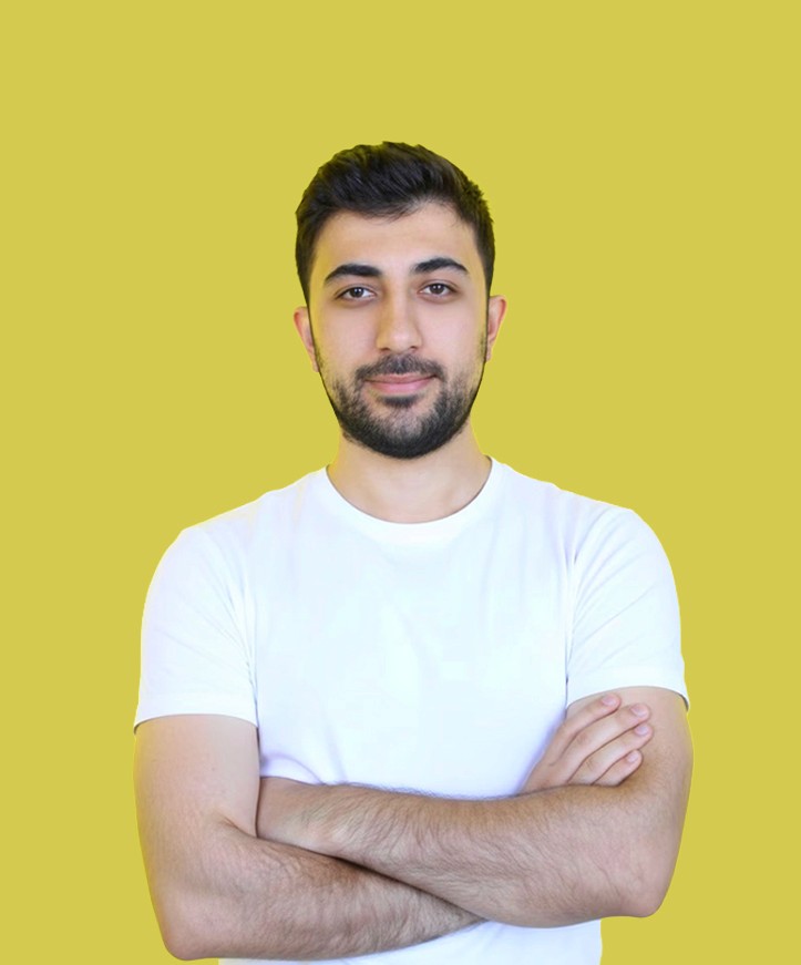 Portrait of a person in dark clothing speaking on a phone