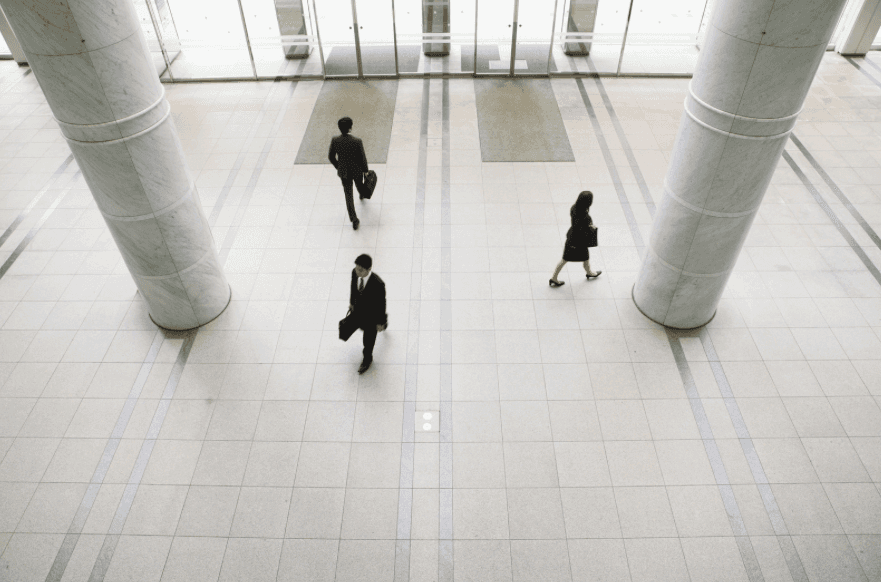 Professionals walking through a modern business office