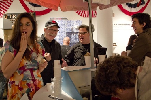 people talking at exhibition