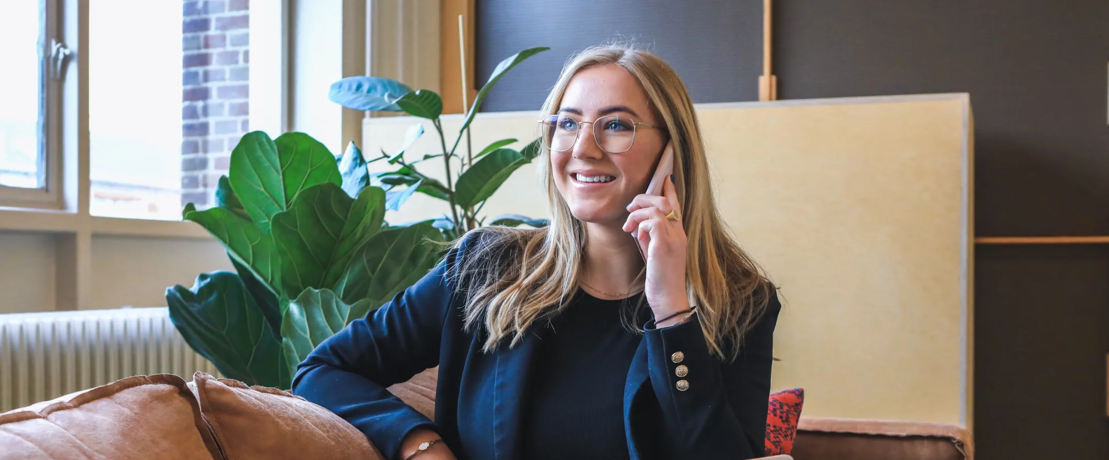 Smiling customer success agent talking on the phone
