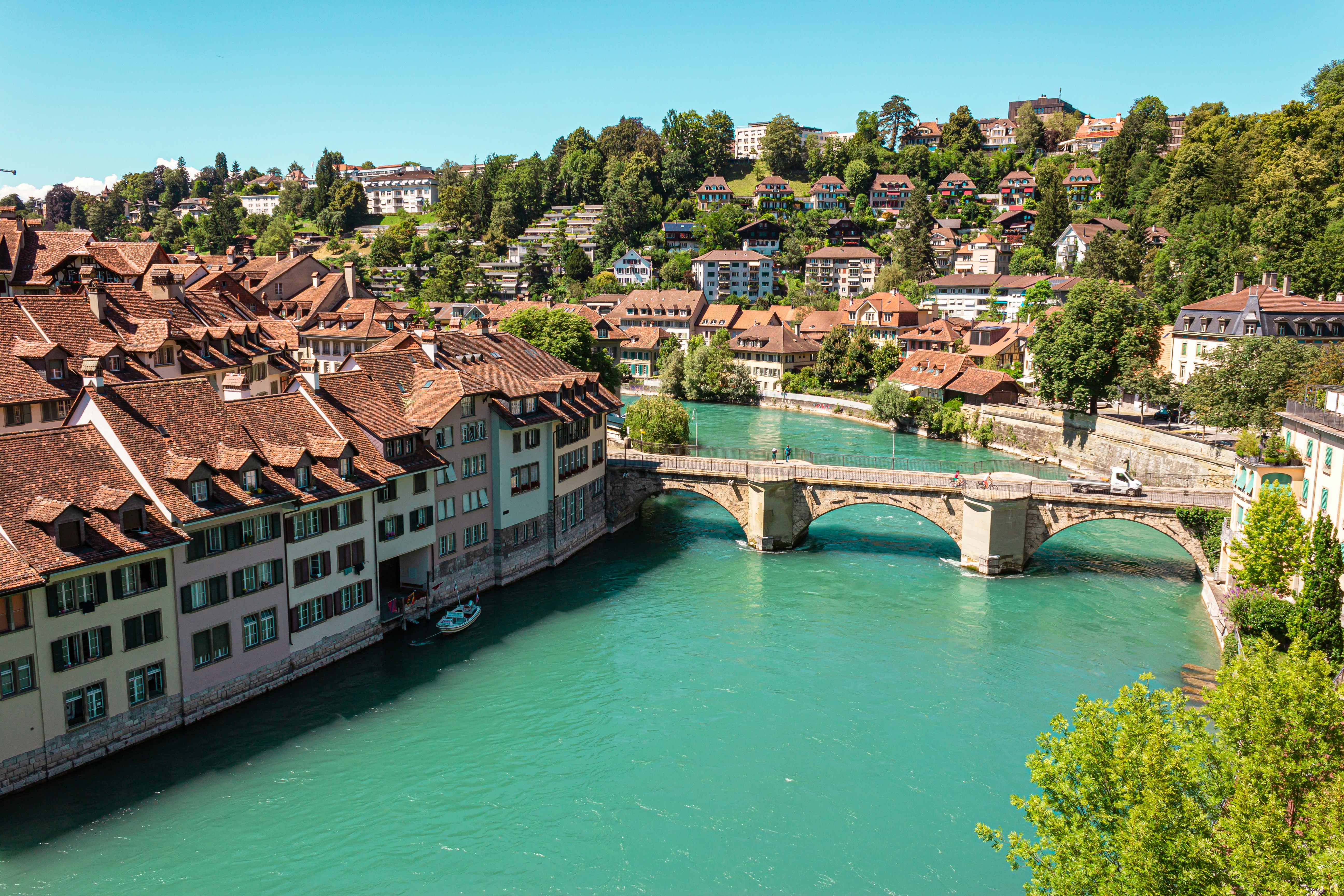 a bridge over a river with buildings on either side of it
