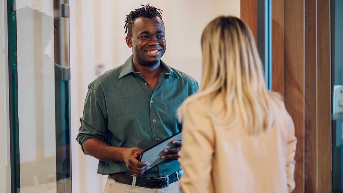 Two workshop facilitators discussing workshop outcomes.