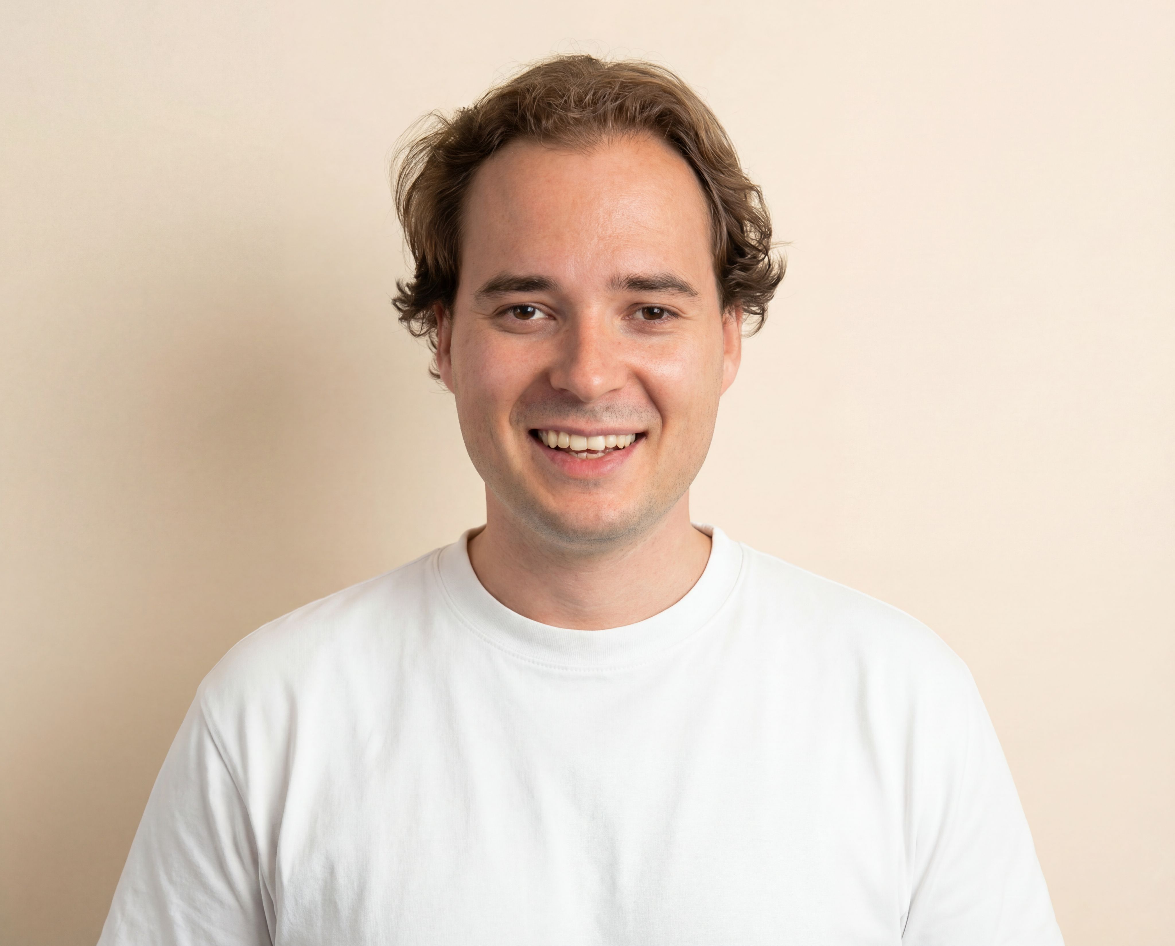 A smooth, abstract organic shape with pink and green swirls floats against a muted green background, showcasing modern art design and fluid form.