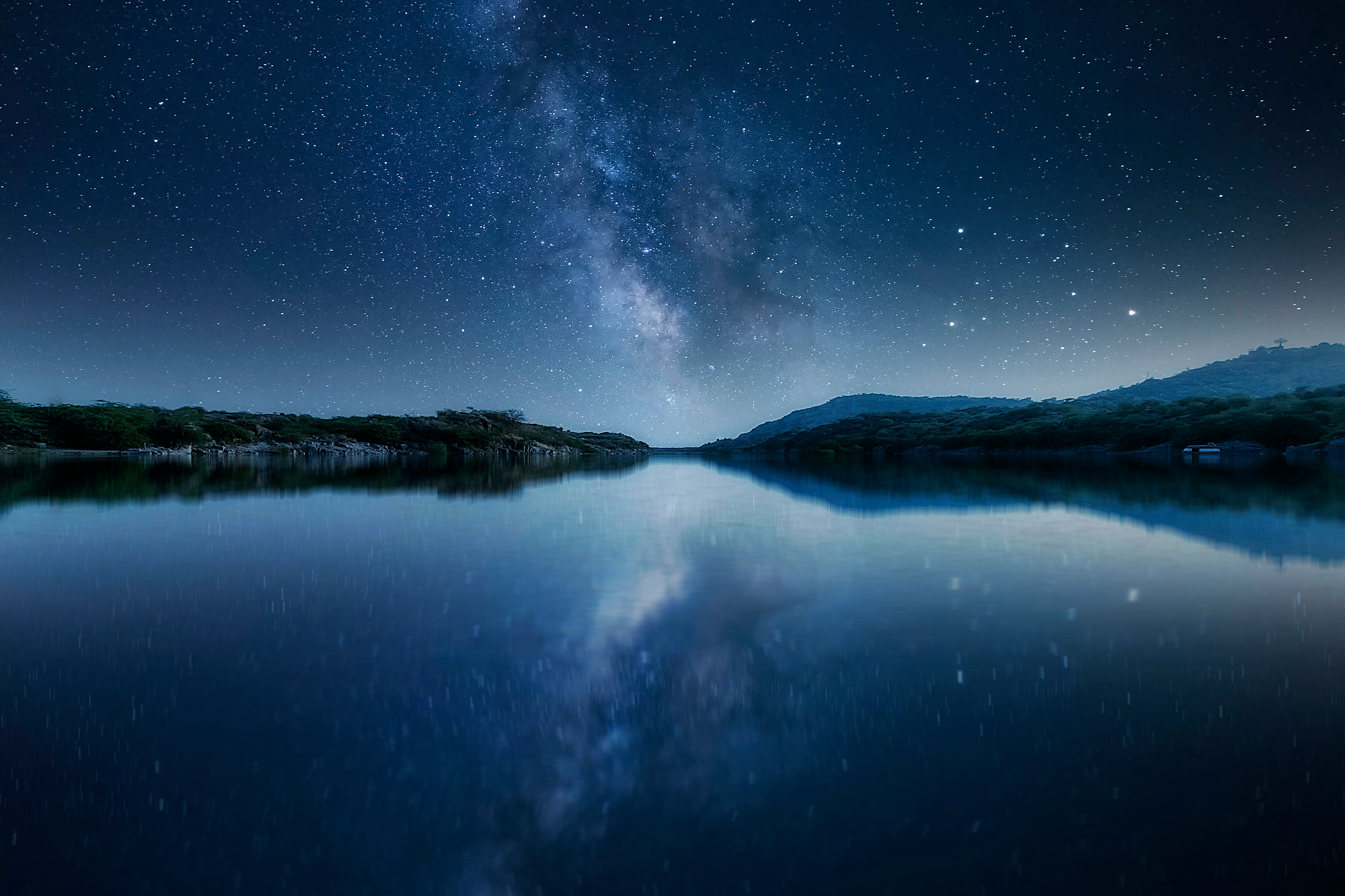 body of water under starry night