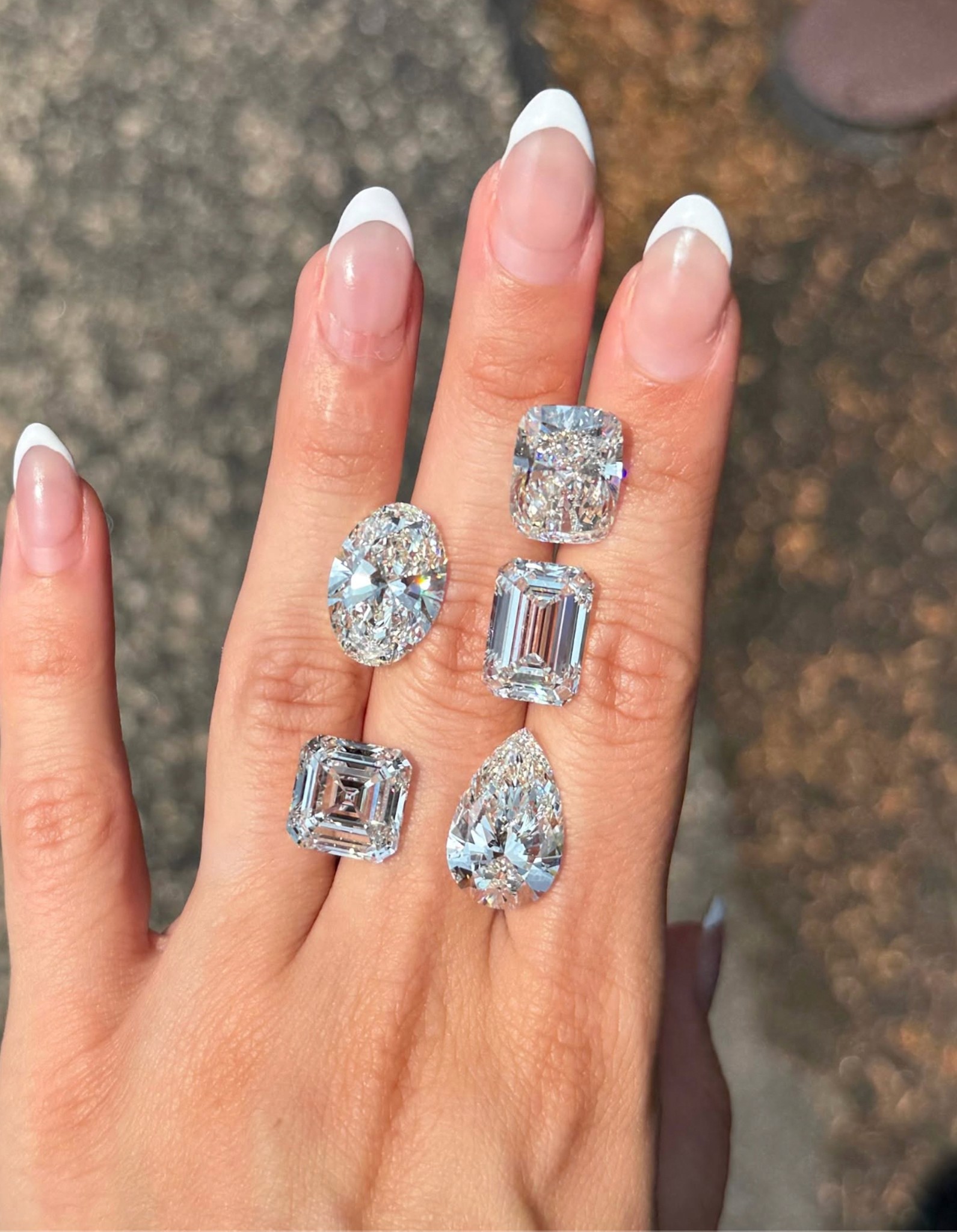 A selection of fancy cut lab-grown diamonds including asscher, radiant and emerald.