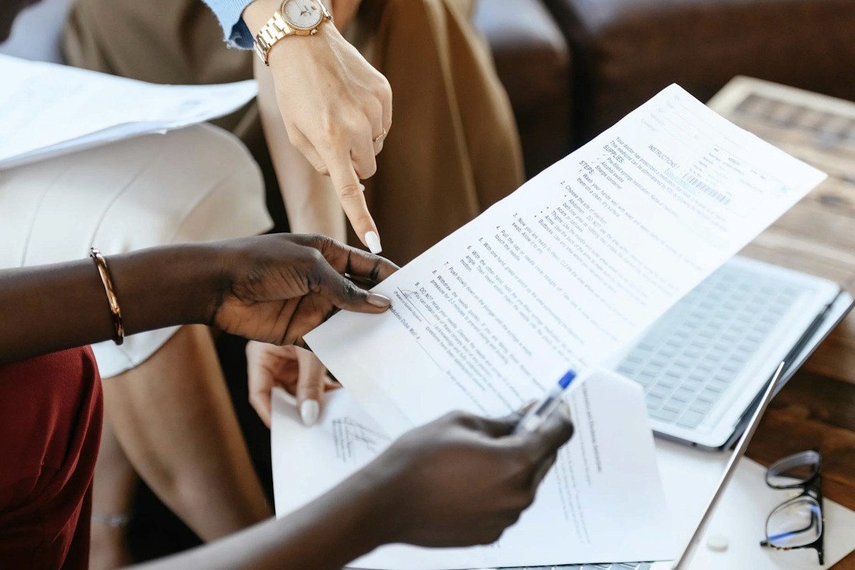 person reading document - Best Software For Automating Document Templates