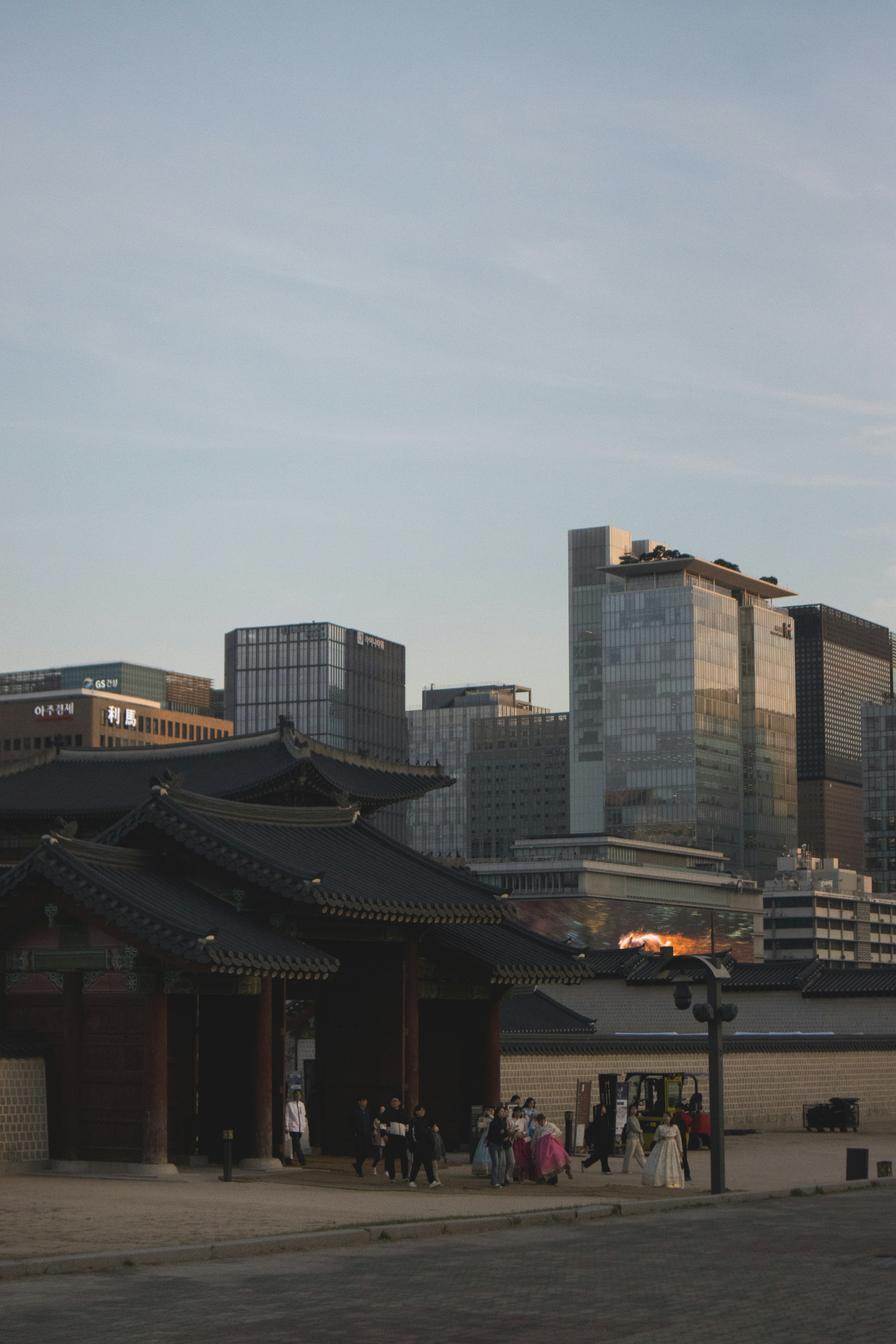 Traditional korean architecture with modern city skyline.