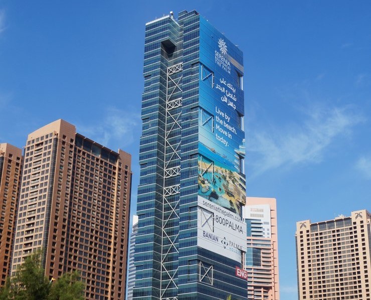 Exterior view of The One Tower featuring premium office spaces and real estate listings in Dubai.