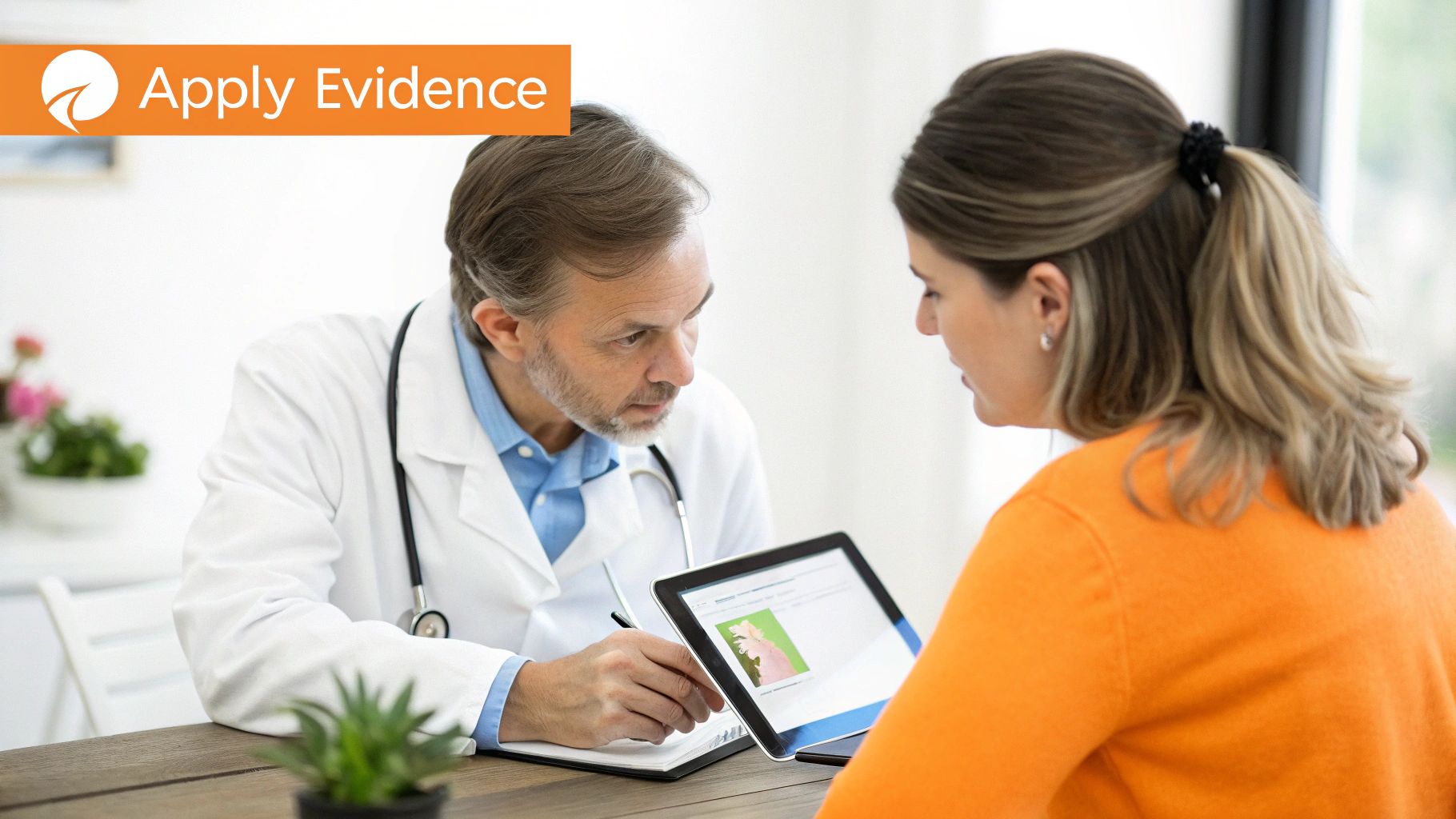 Doctor consults with patient, showing medical data on a digital tablet.
