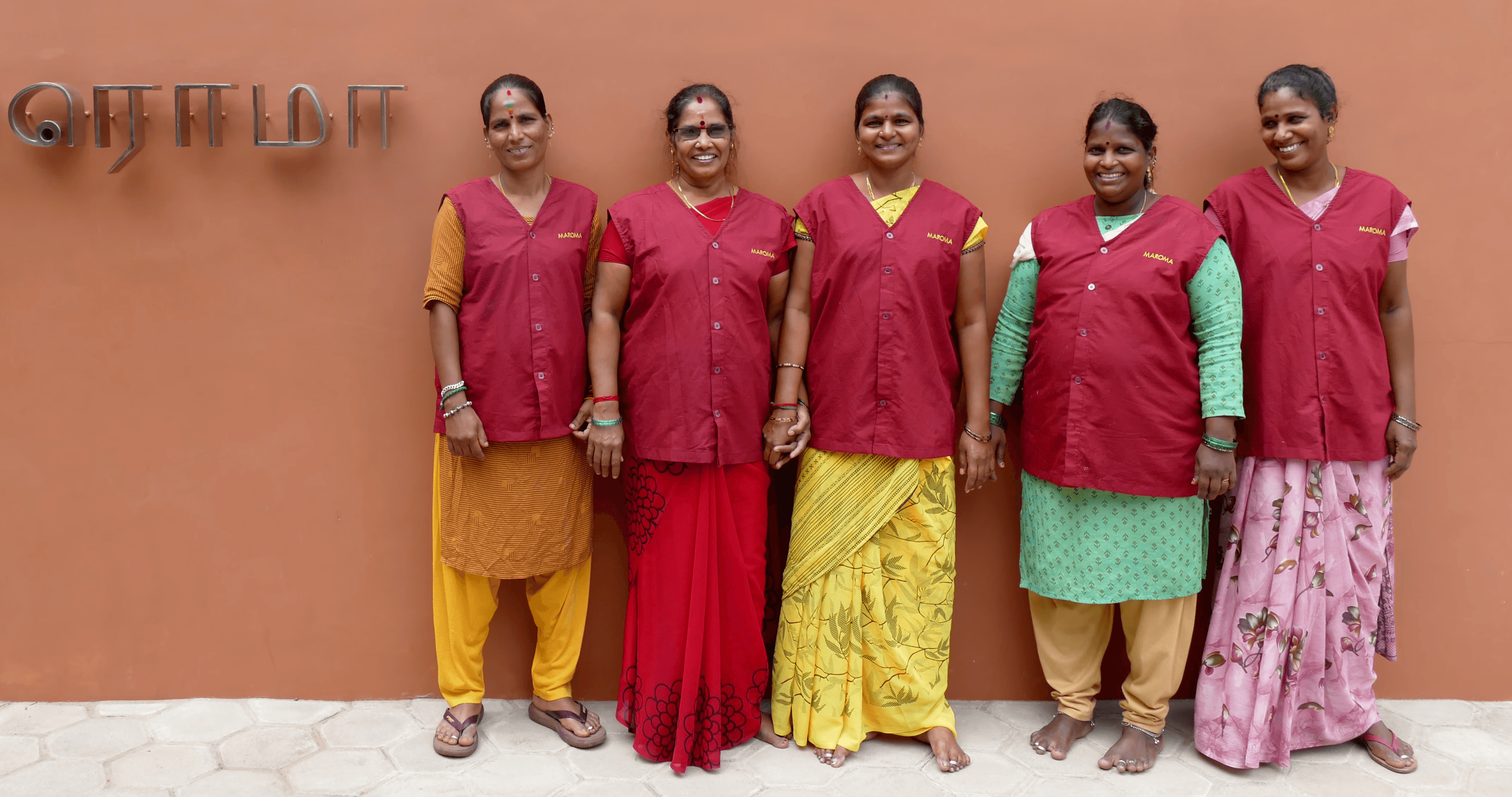 A woman lying down on a soft surface with her eyes closed, bathed in warm sunlight filtering through leaves. Her face has a natural glow, reflecting relaxation and tranquility in a serene spa-like setting.