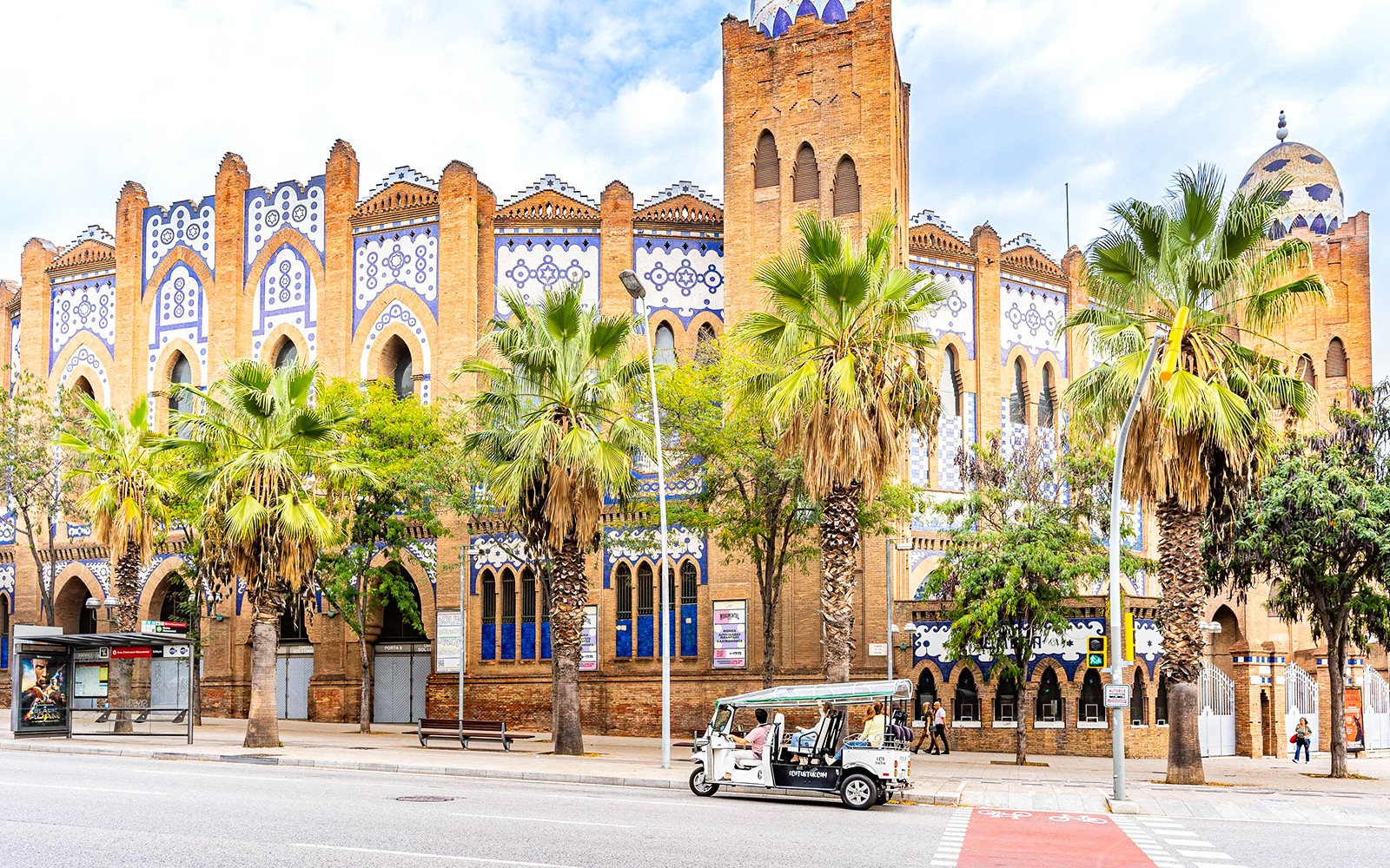Tuk tuk tour passing by Sagrada Familia in Barcelona.