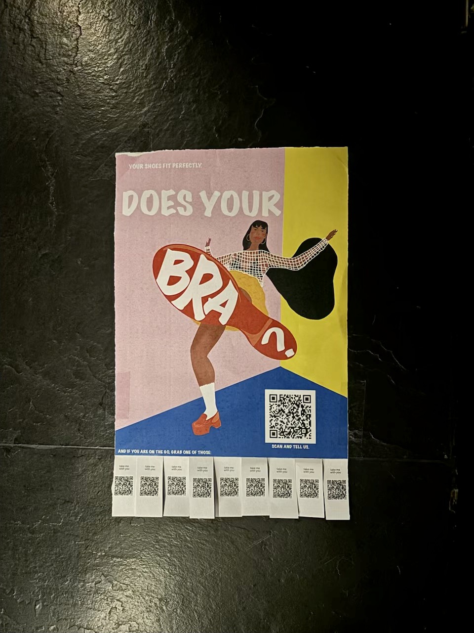 Poster: “Your shoes fit perfectly. Does your bra?” with kicking woman, survey QR code, on a wall of a club in Bangalore.