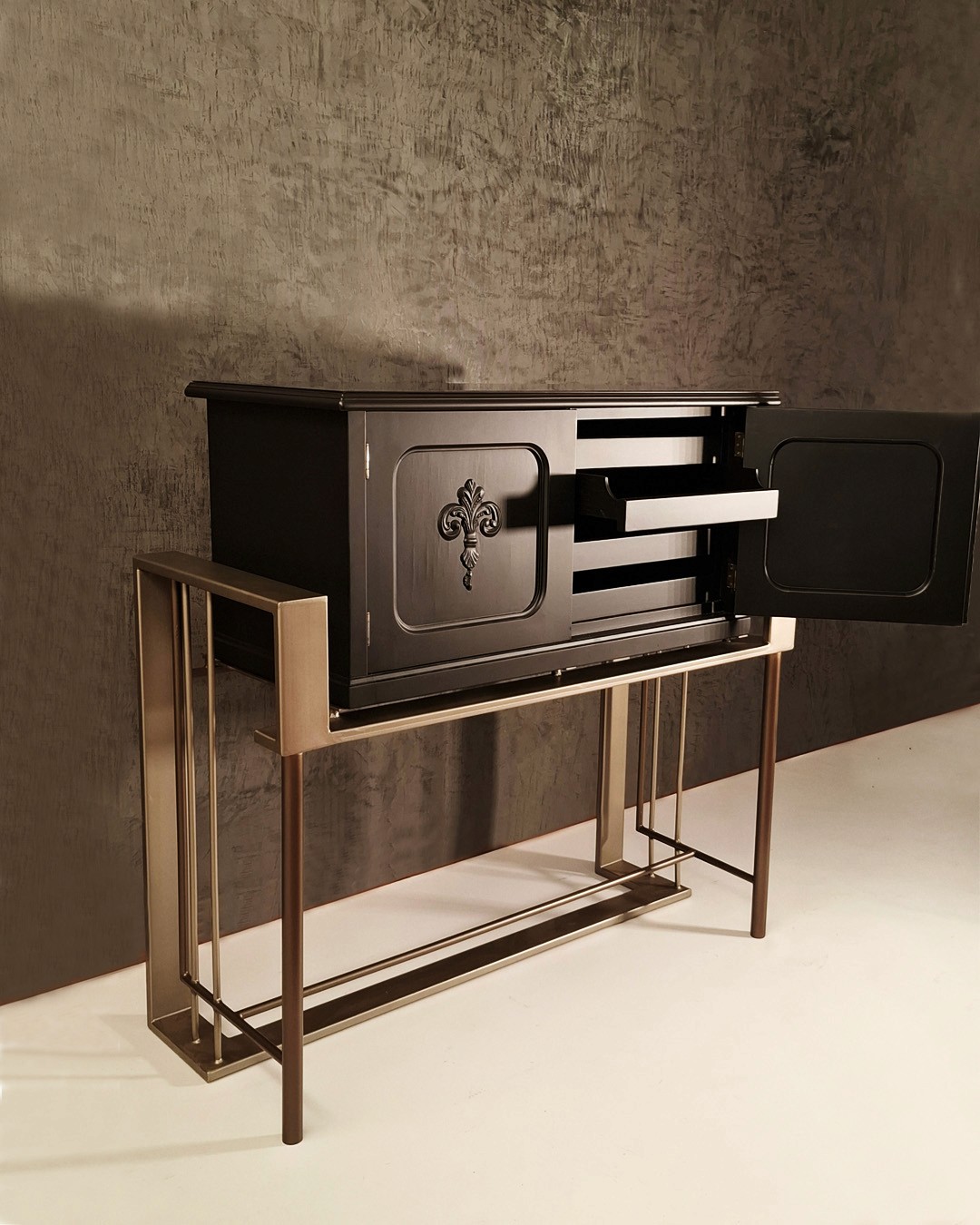 Contemporary steel base supporting a vintage inspired cabinet body with open door display  