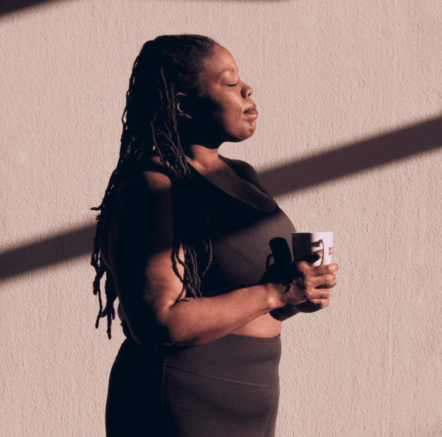 Breathing and holding a cup of coffee