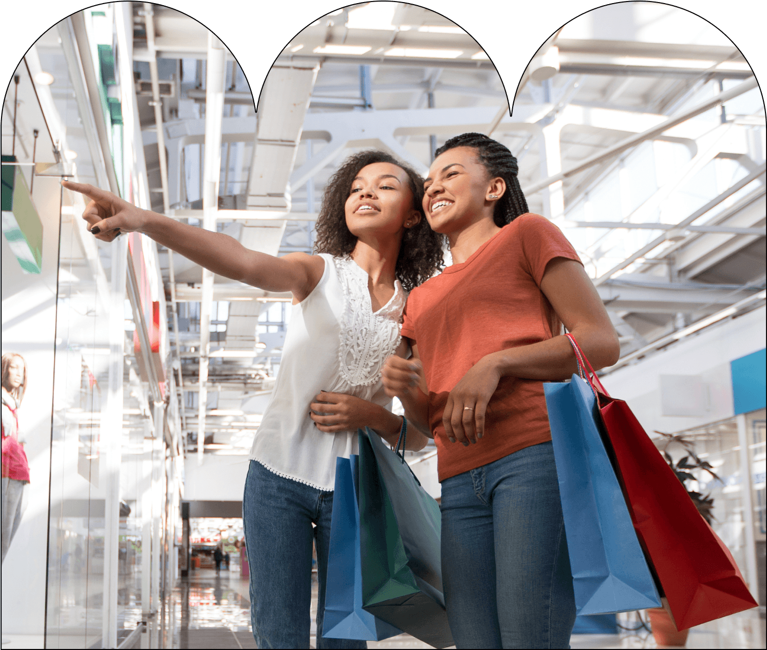 Two young women are shopping in a store, smiling and pointing at something on the shelf. They are carrying shopping bags. Around the image, there are logos of well-known retailers like eBay, Adidas, and Amazon, suggesting that Breezy is accepted at various stores.