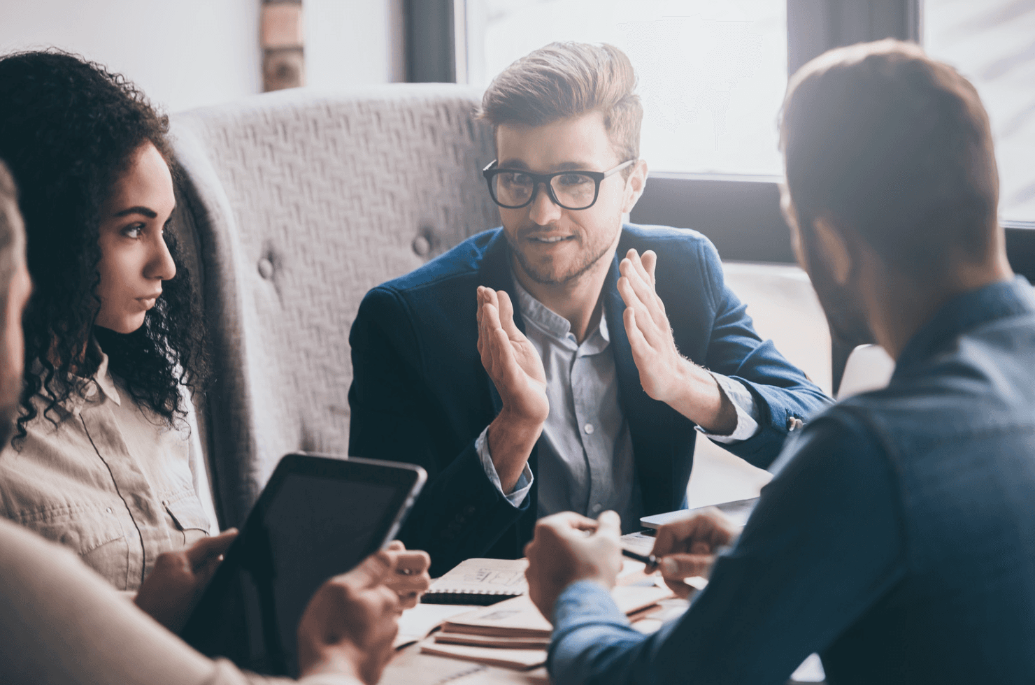 Amazon PPC management team meeting discussing automated campaign strategies and ASIN-level optimization